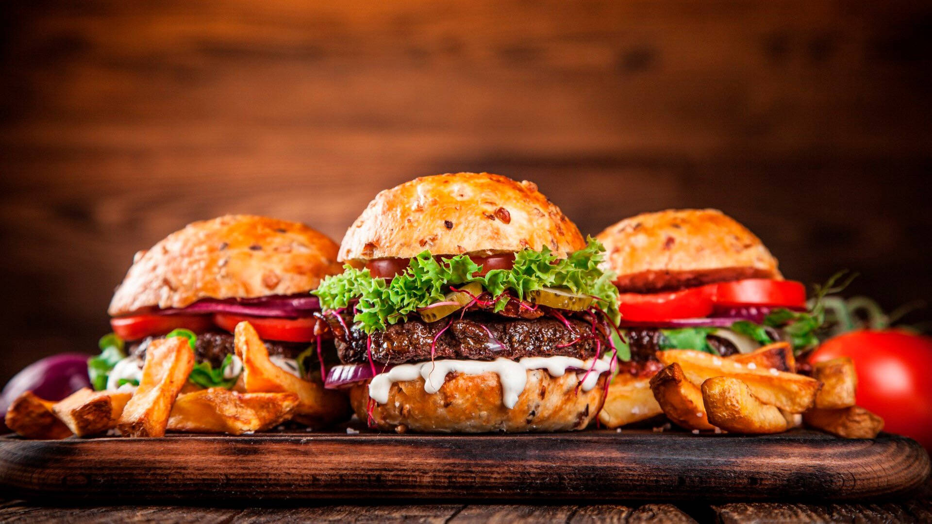 Premium Cheeseburgers, rustic wooden board, crispy fries, Full HD Desktop Wallpaper