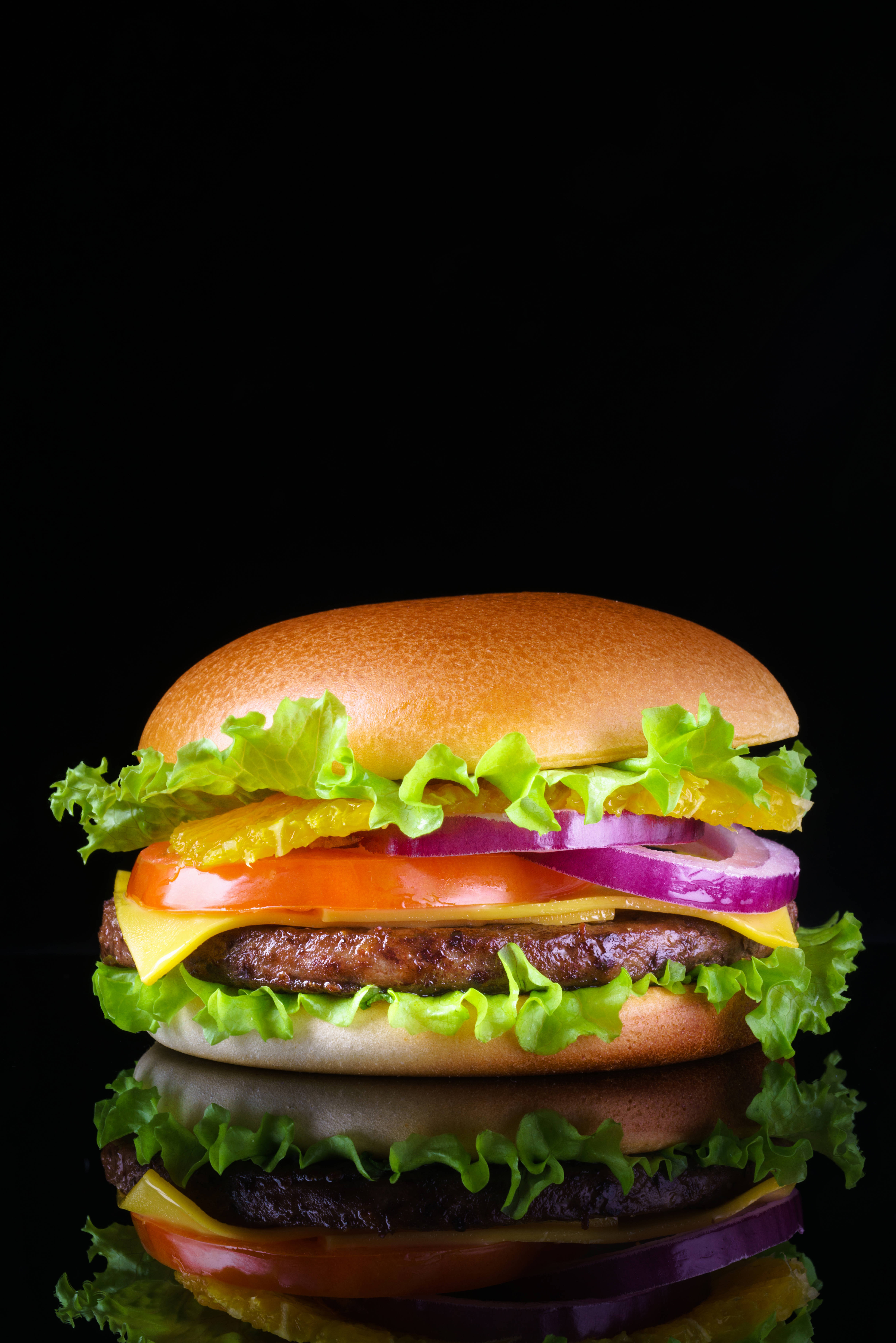cheeseburger, black reflective surface, lettuce, 5K Phone Wallpaper