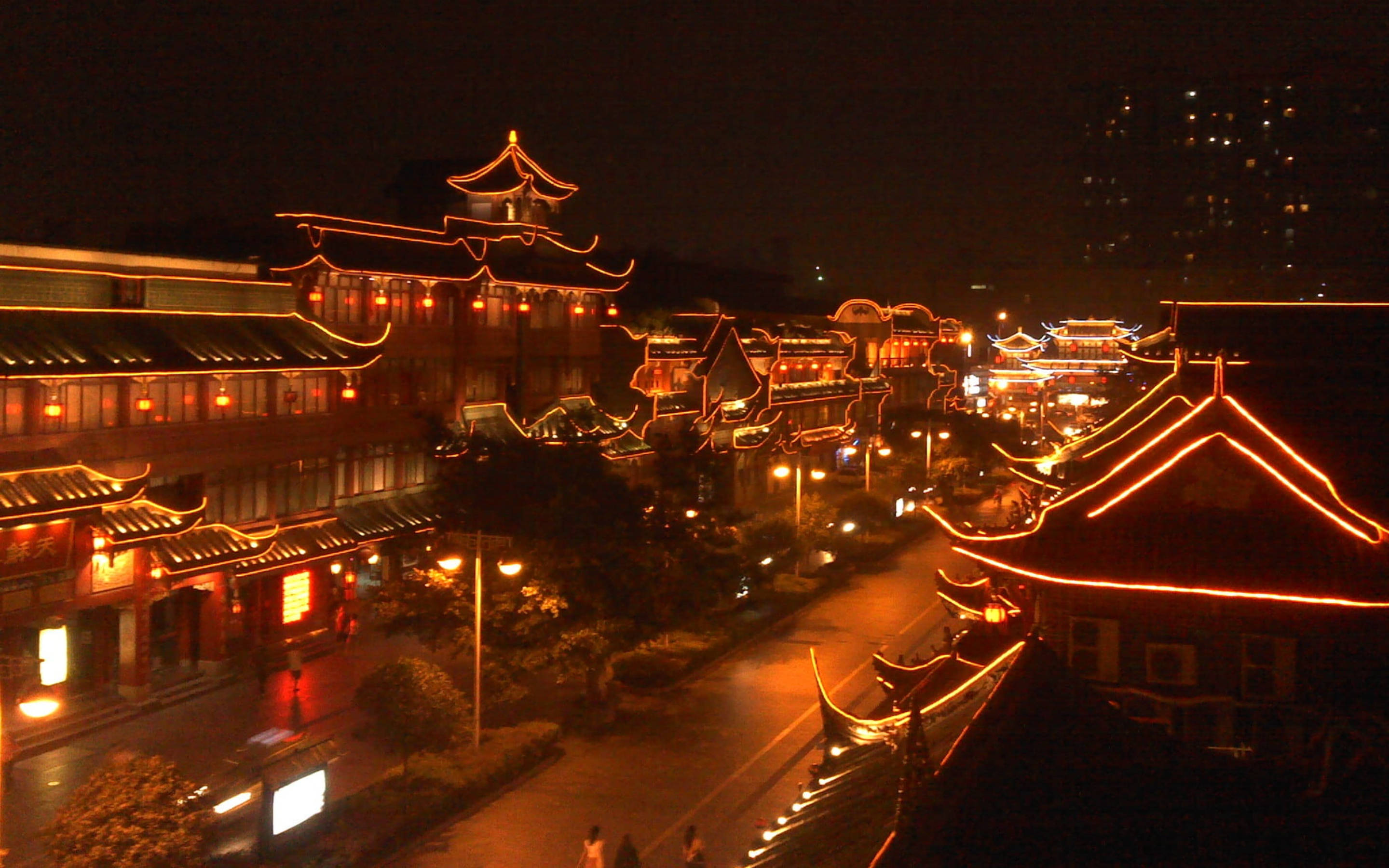 Chengdu, traditional Chinese architecture, warm orange neon lights, 2K Desktop Wallpaper