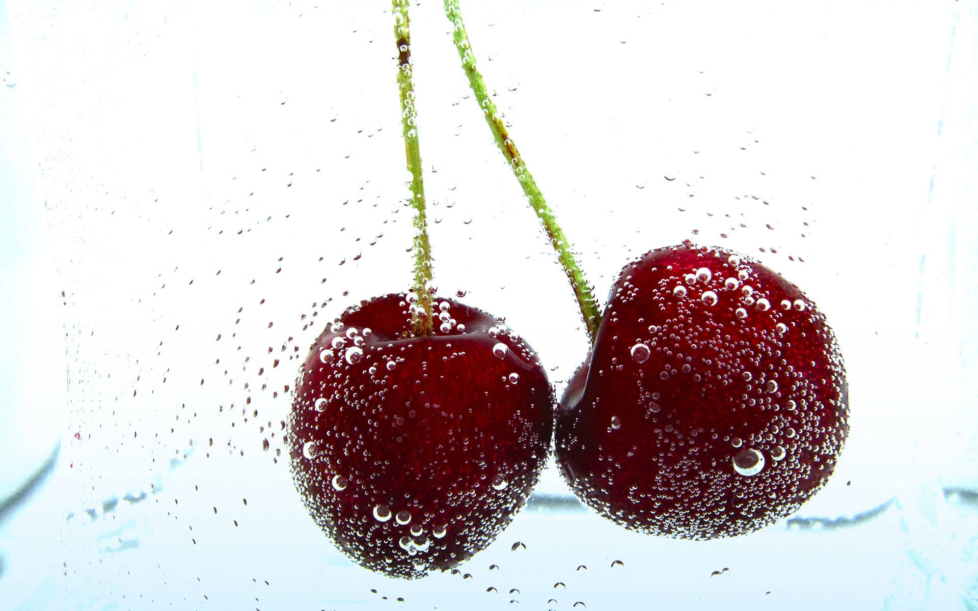 Fizzing Pair Of Cherries, plump red cherries, green stems, Full HD Desktop Wallpaper