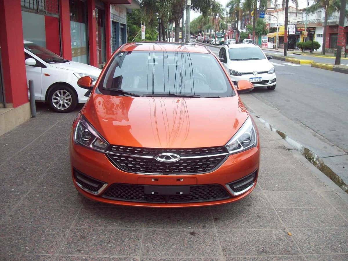 Chery Arrizo 5, vibrant orange, wet city sidewalk, SD Desktop Wallpaper