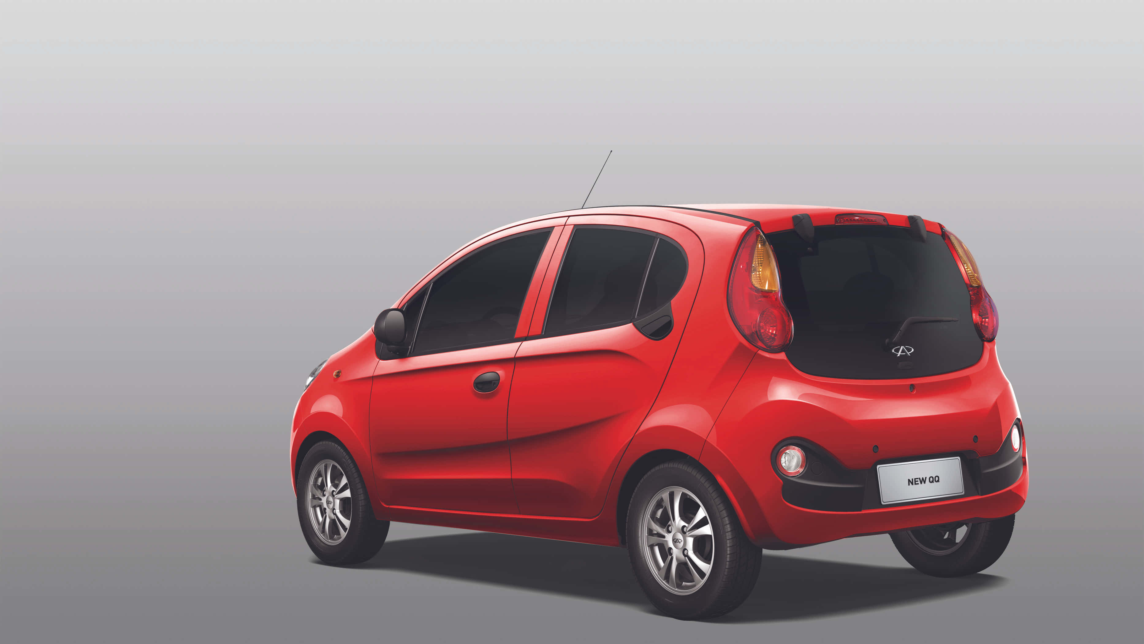 Chery QQ, vibrant cherry red, three-quarter rear view, 2K Desktop Wallpaper