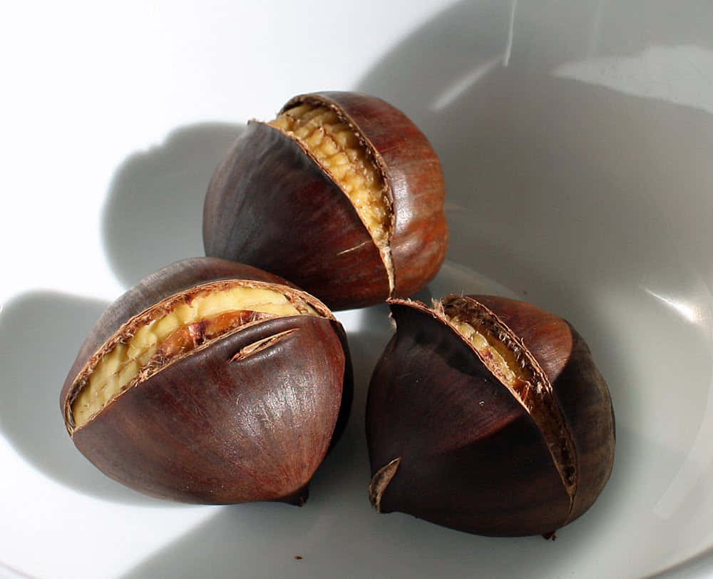Chestnut, wooden surface, white ceramic bowl, SD Desktop Wallpaper