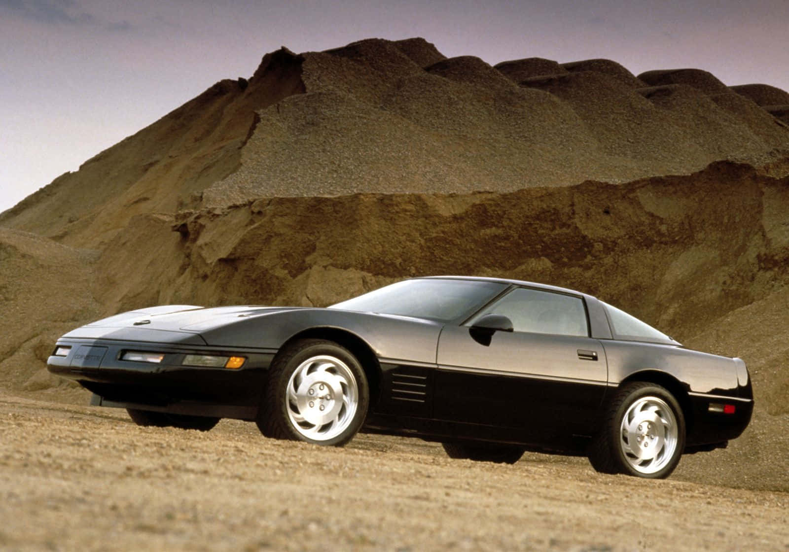 Chevrolet Corvette C4, sleek black sports car, dusty terrain, HD Desktop Wallpaper