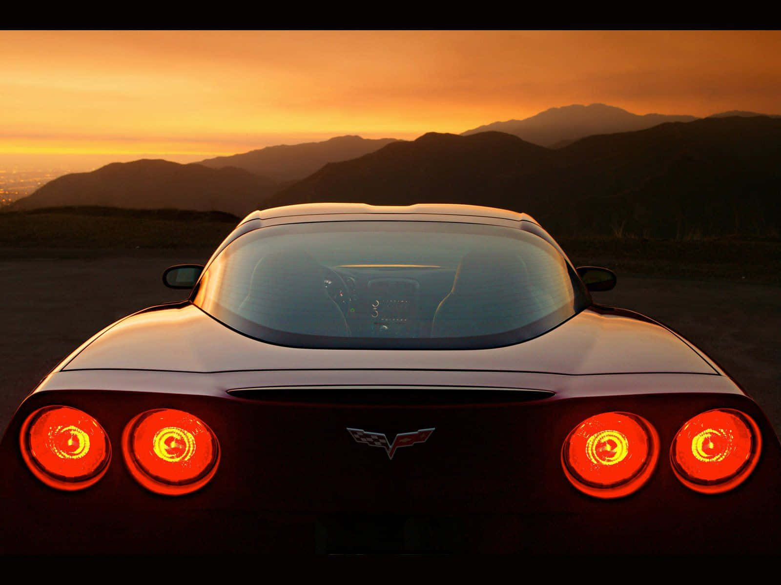 Chevrolet Corvette C5, sleek black sports car, glowing red taillights, HD Desktop Wallpaper