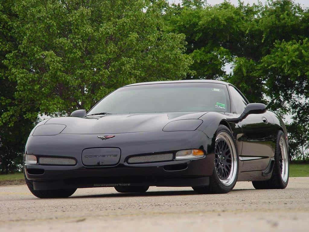 Chevrolet Corvette C5, sleek black, gravel, SD Desktop Wallpaper