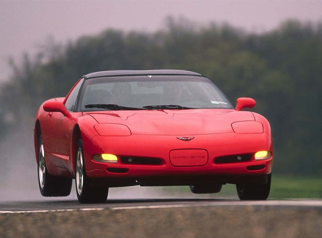 Chevrolet Corvette C5, vibrant red, wet road, SD Desktop Wallpaper