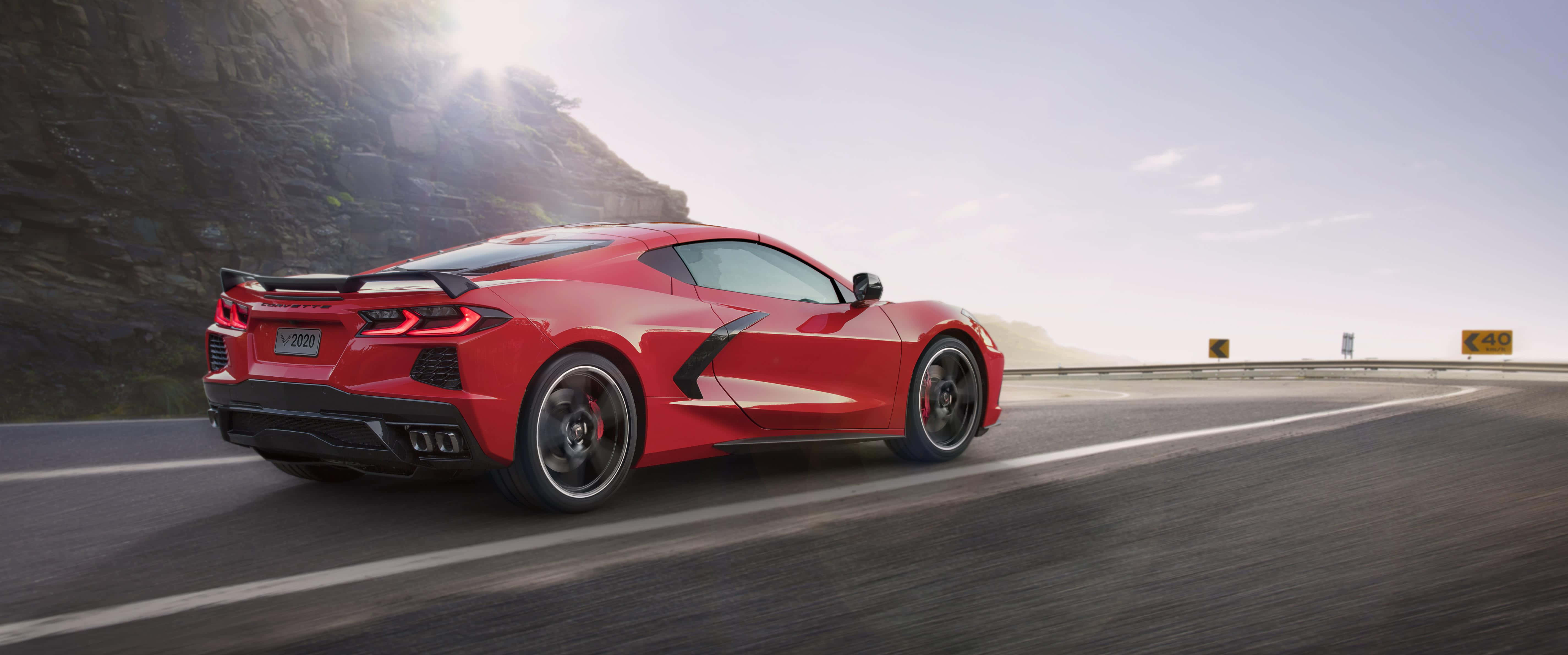 2020 Chevrolet Corvette C8, vibrant red, winding mountain road, 5K Desktop Wallpaper