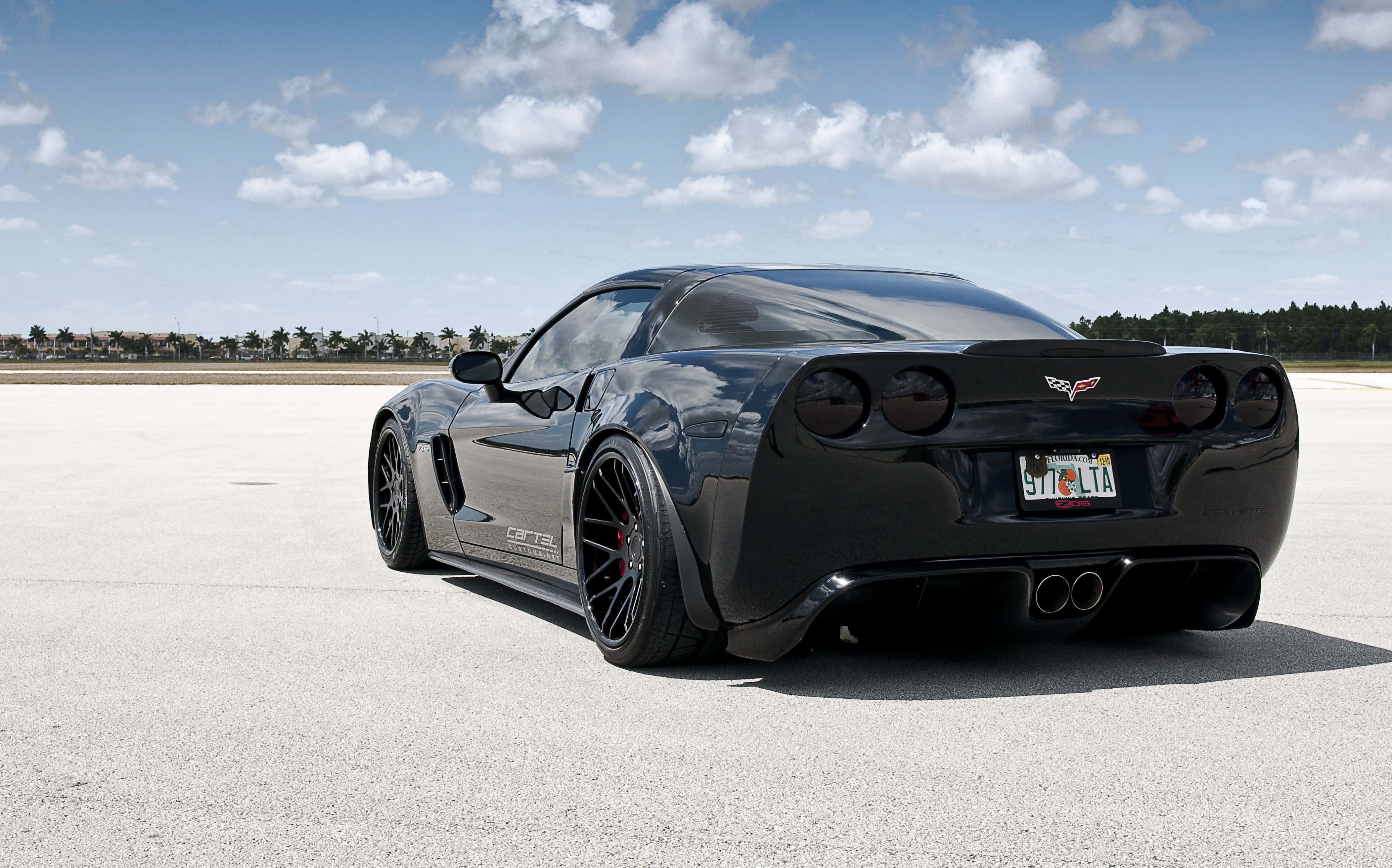 Chevrolet Corvette Z06, black, concrete lot, 4K Desktop Wallpaper