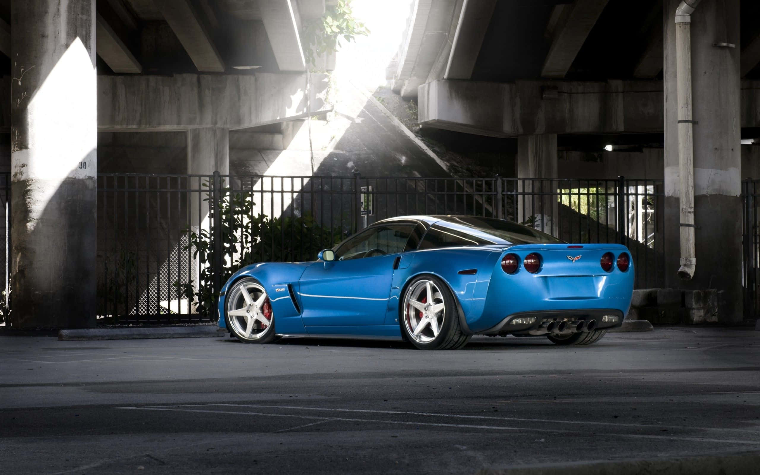 Chevrolet Corvette Z06, vibrant blue, urban overpass, 2K Desktop Wallpaper