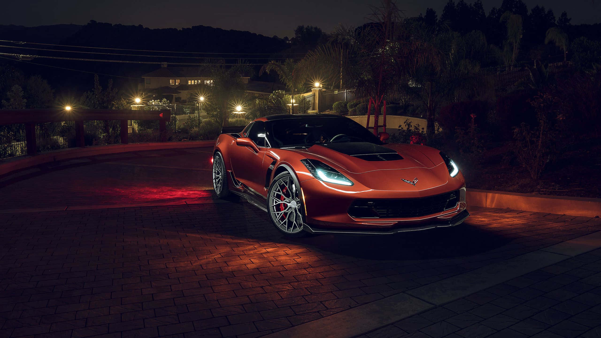 Chevrolet Corvette Z06, glowing red, brick driveway, 2K Desktop Wallpaper