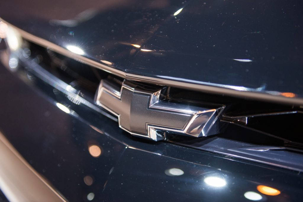 Chevrolet Logo, chrome, sleek black car hood, SD Desktop Wallpaper