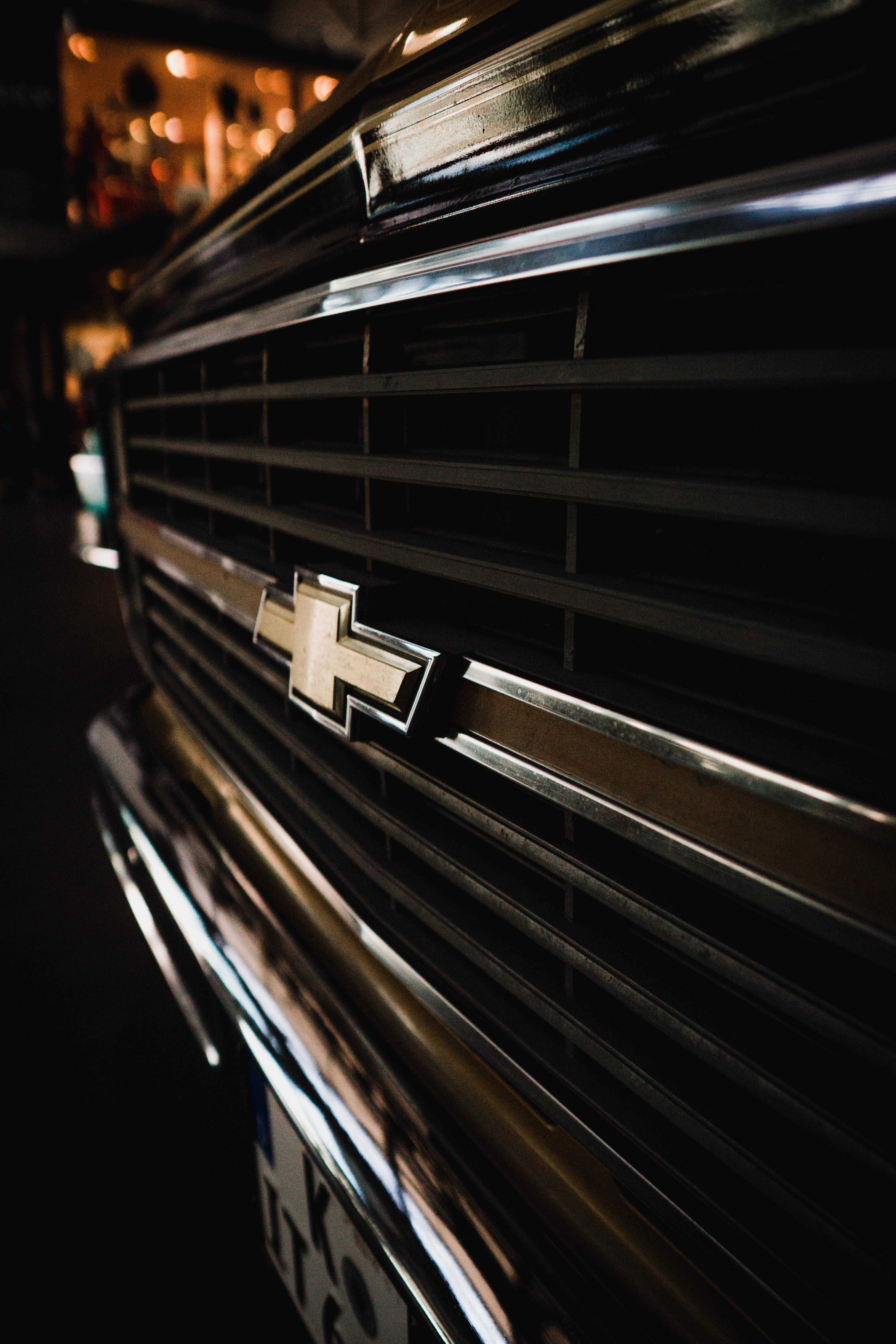 Chevrolet truck grille, chrome accents, glowing lights, 5K Phone Wallpaper