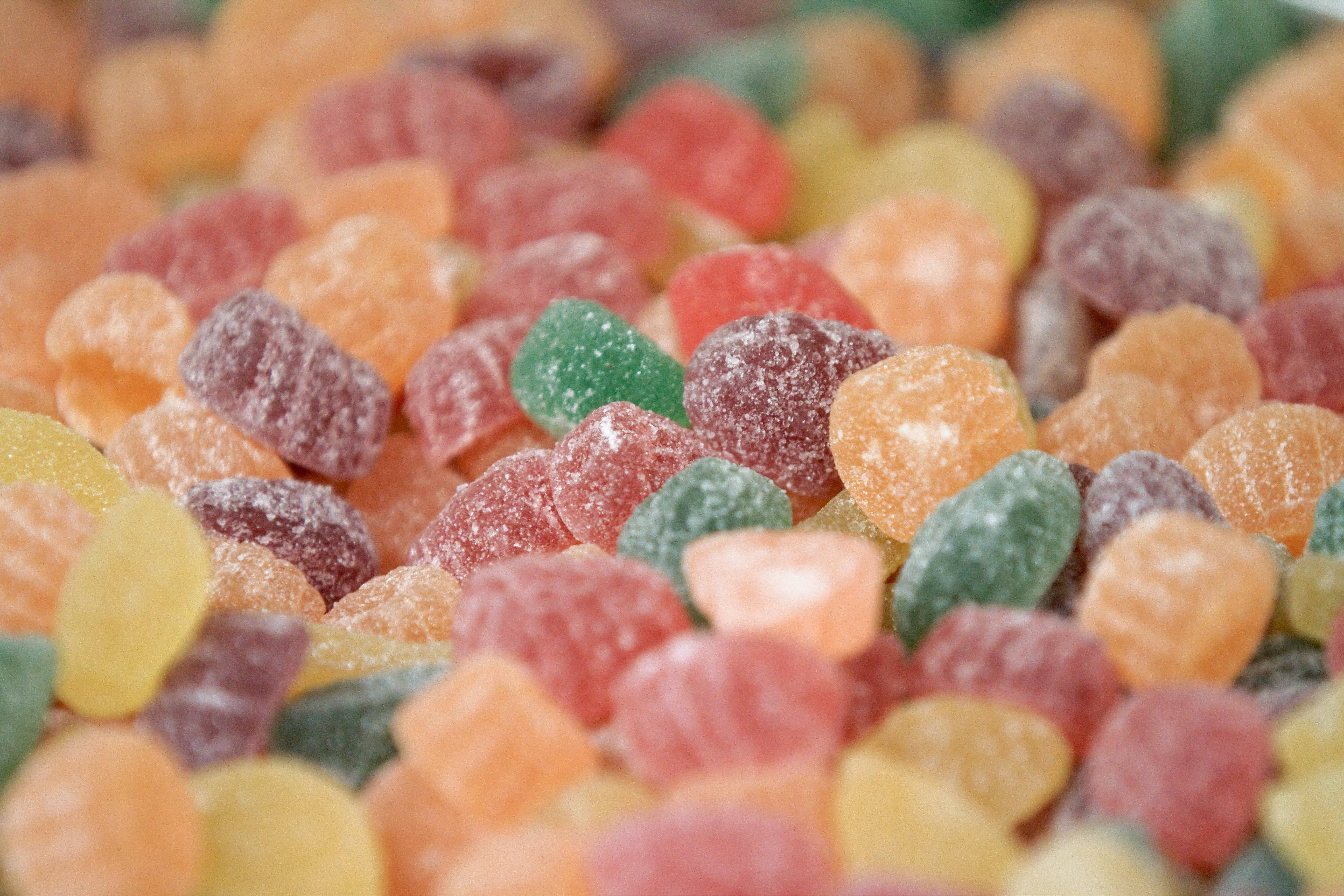 colorful coated chewy candies, vibrant red, orange, 5K Desktop Wallpaper
