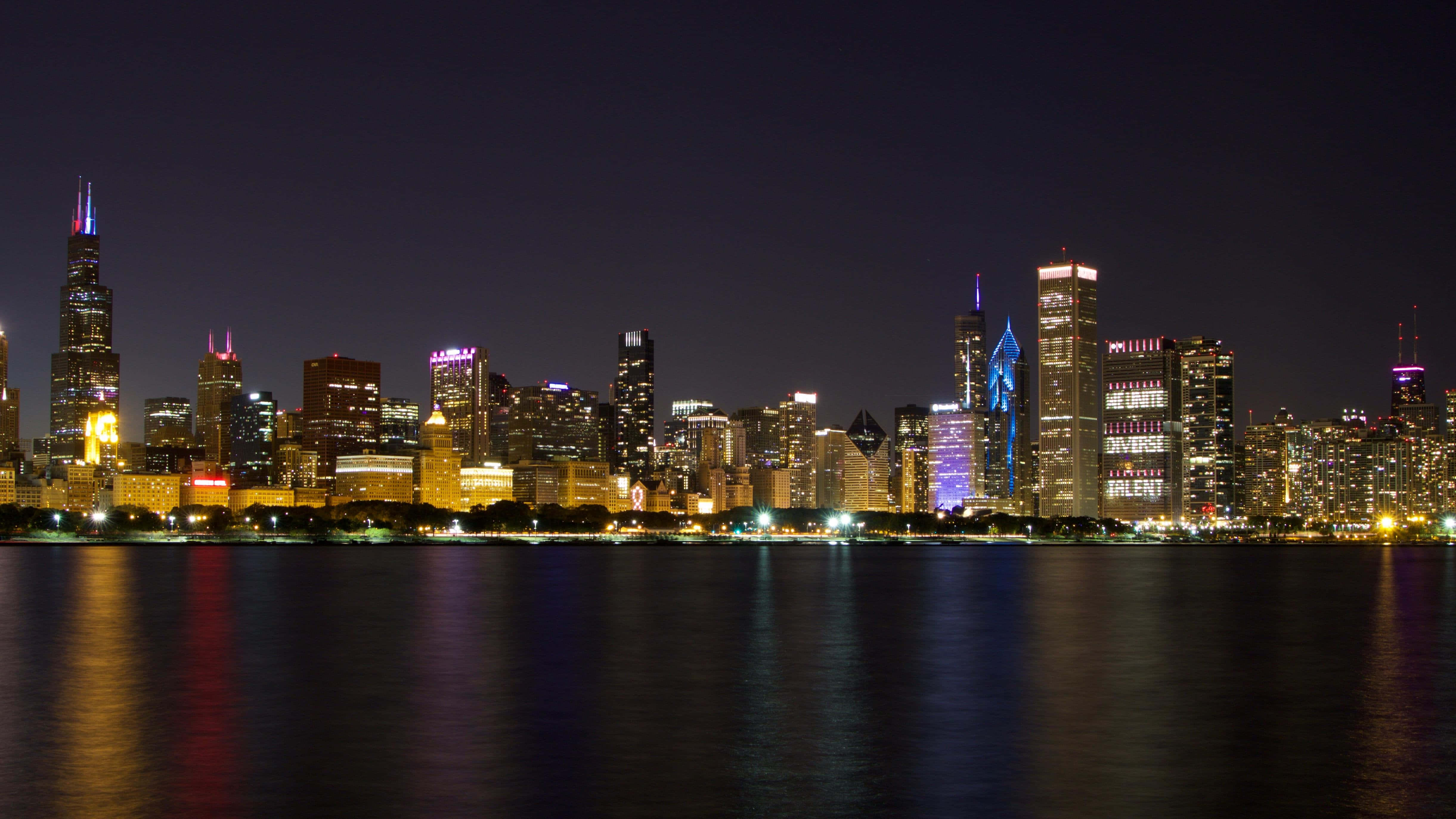 Chicago skyline, illuminated skyscrapers, calm water, 4K Desktop Wallpaper