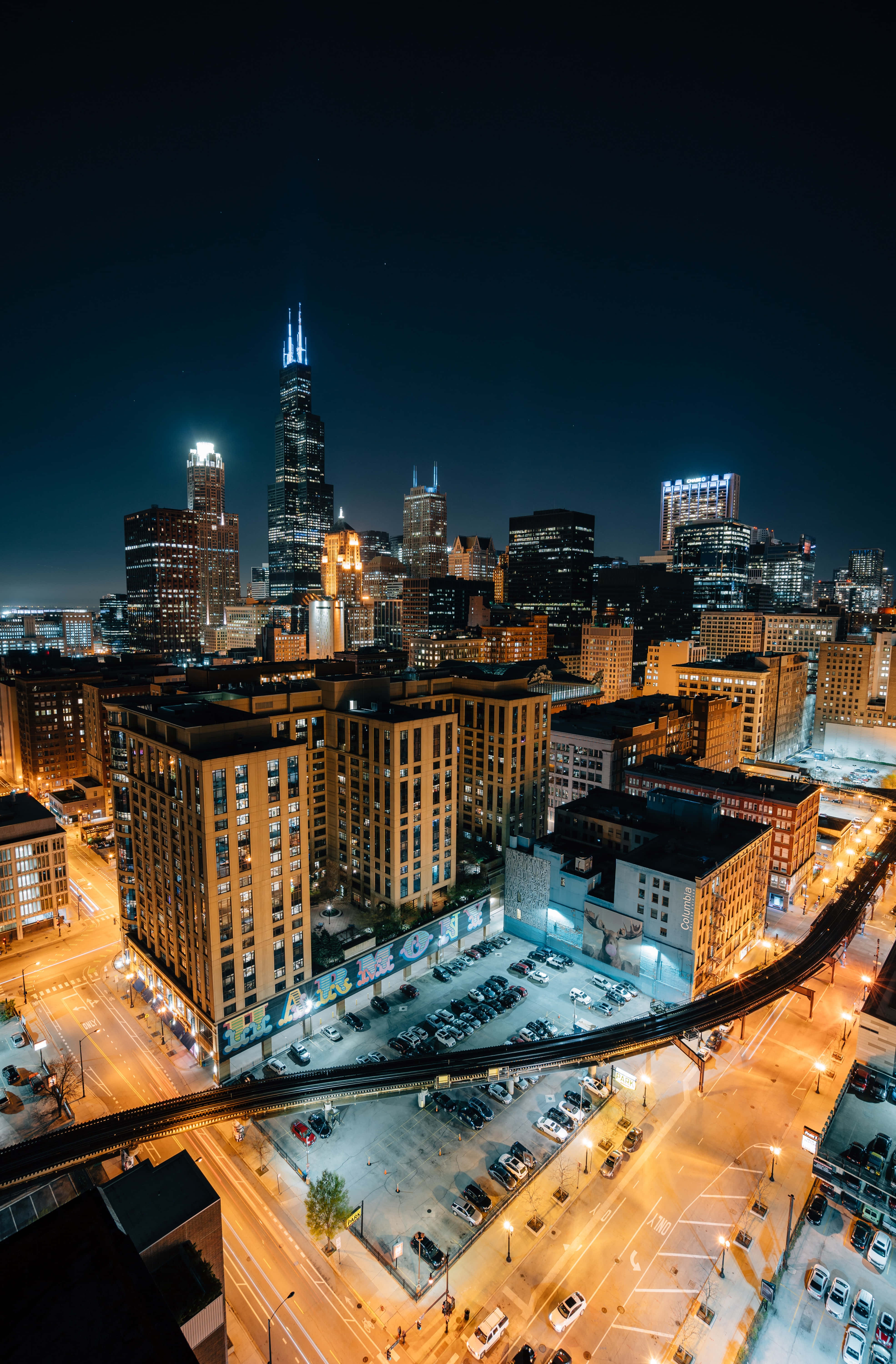 Chicago skyline, glowing skyscrapers, illuminated streets, 5K Phone Wallpaper