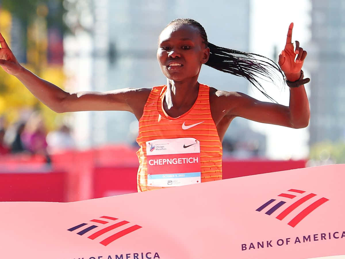 Chicago Marathon, orange Nike tank top, pink Bank of America finish line banner, SD Desktop Wallpaper