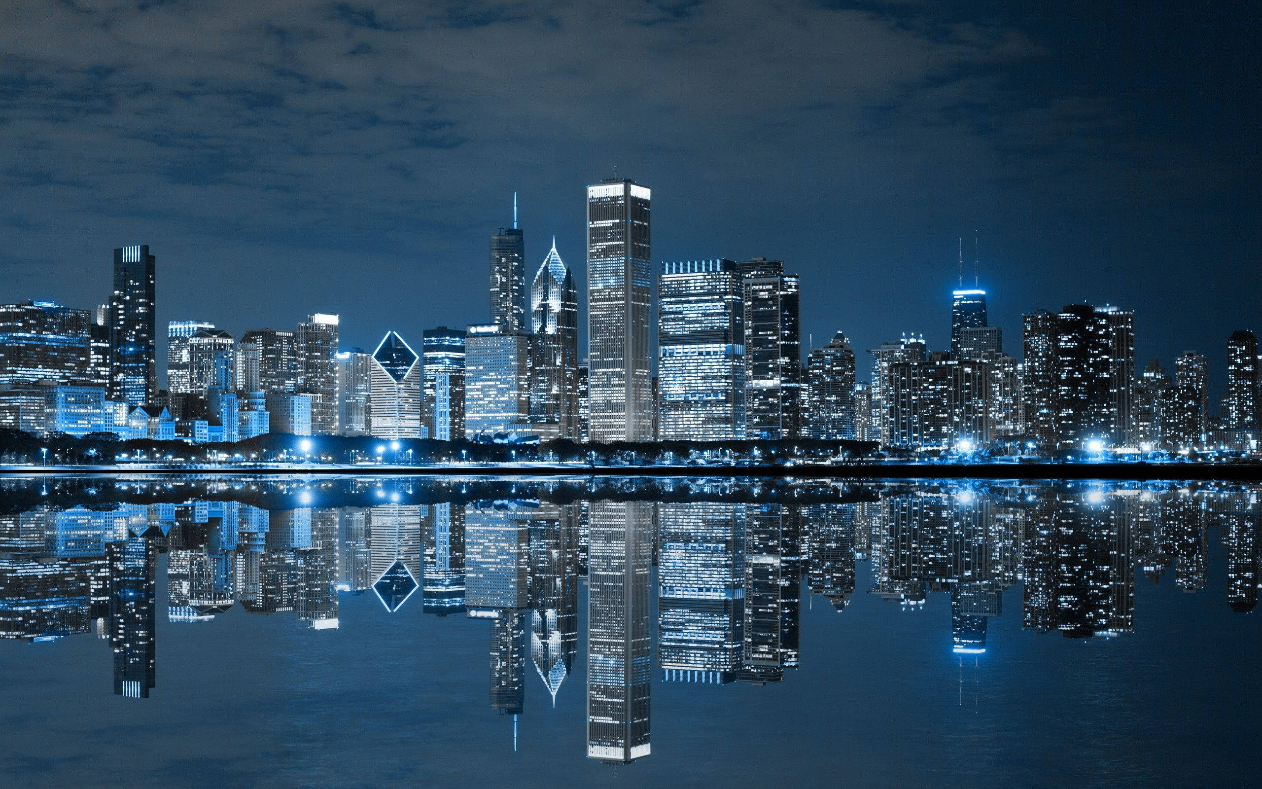Chicago skyline, blue lights, calm water, 2K Desktop Wallpaper