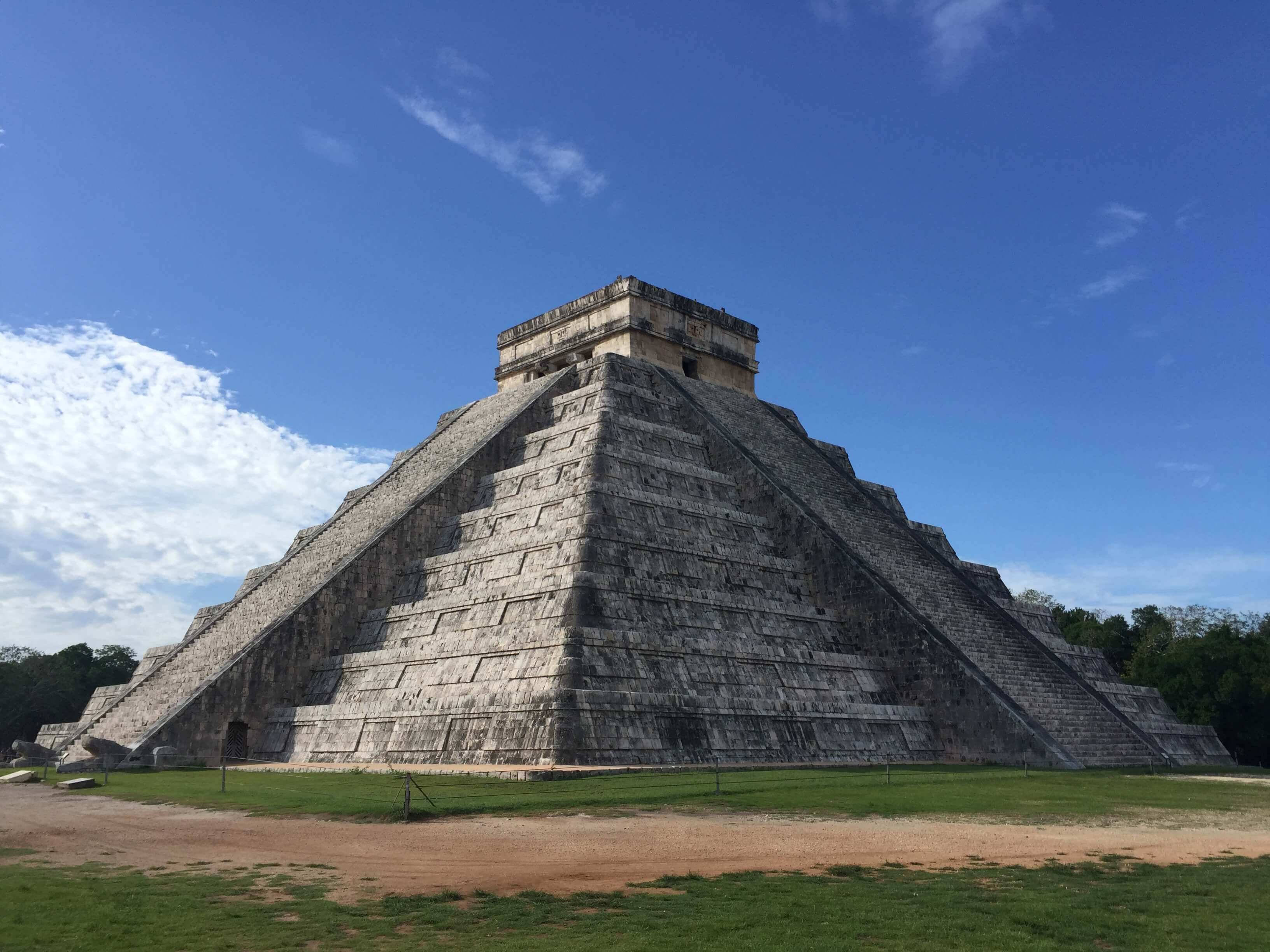 Chichen Itza, ancient Mayan pyramid, bright blue sky, 2K Desktop Wallpaper