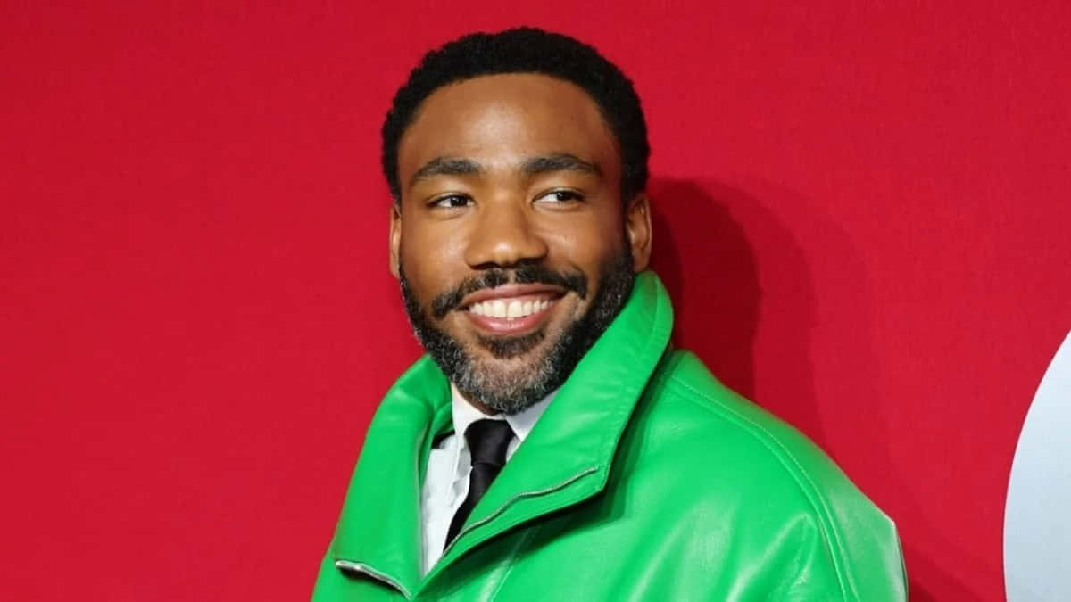 Childish Gambino, bright green leather jacket, solid red background, SD Desktop Wallpaper
