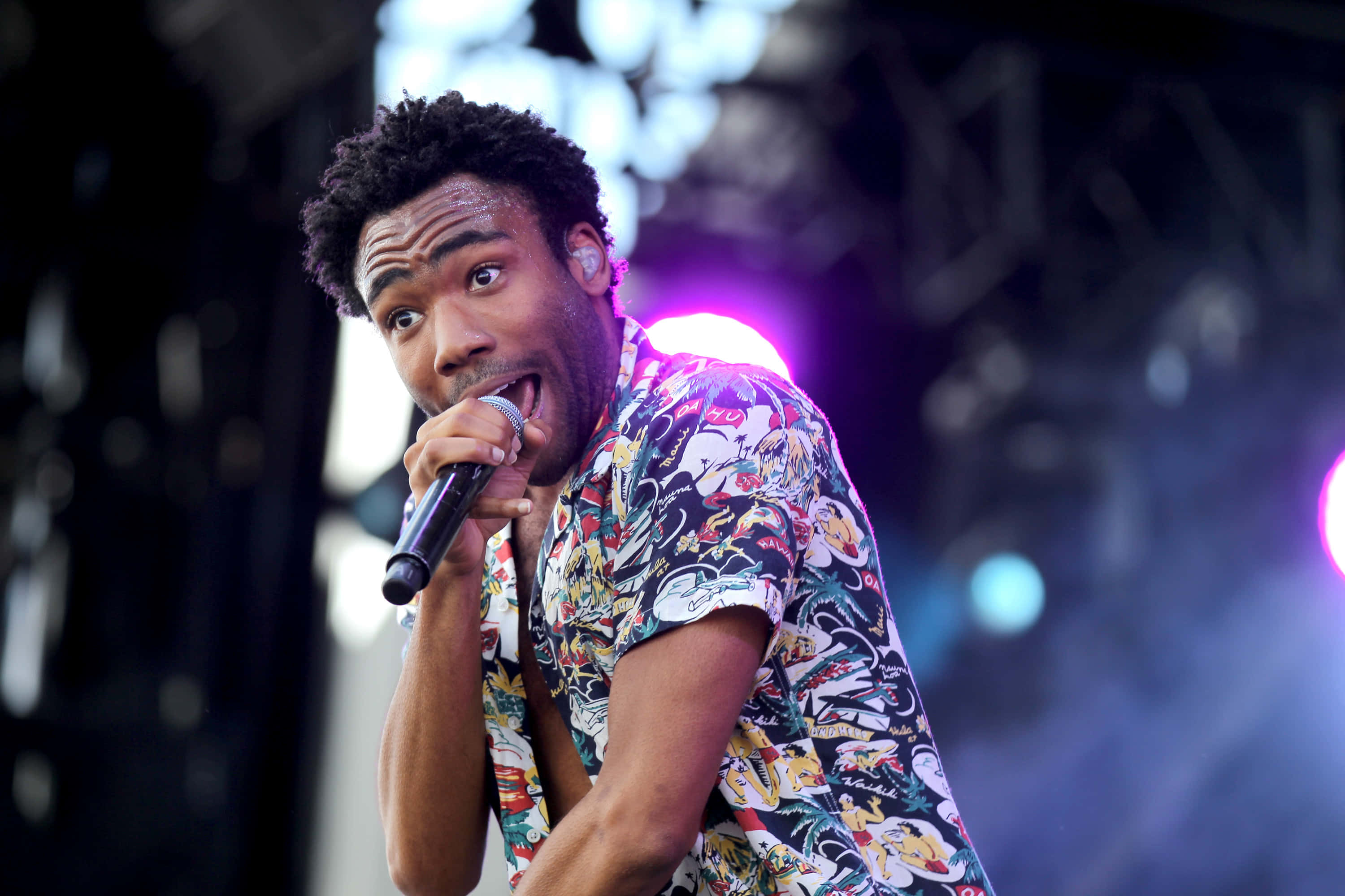 Childish Gambino, vibrant stage lights, microphone, 2K Desktop Wallpaper