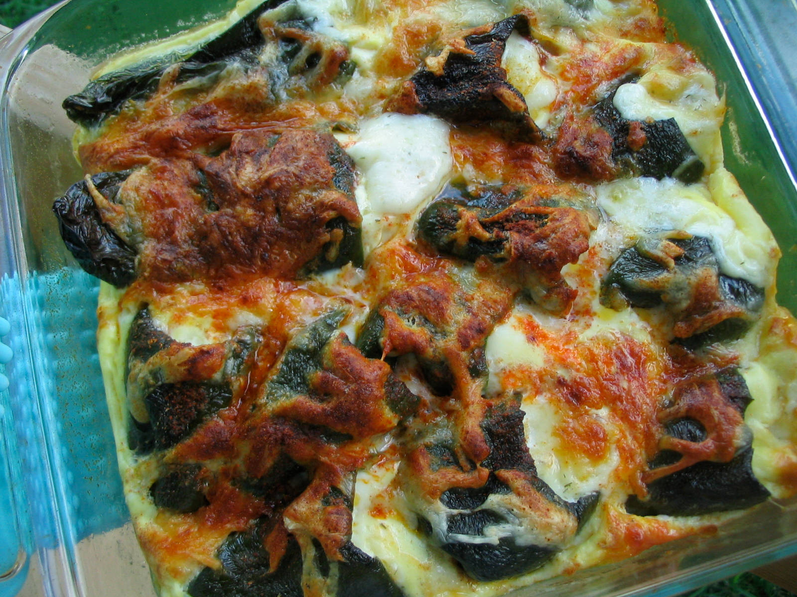 brown puffed up mexican chili relleno, dark leafy vegetables, melted cheese, HD Desktop Wallpaper