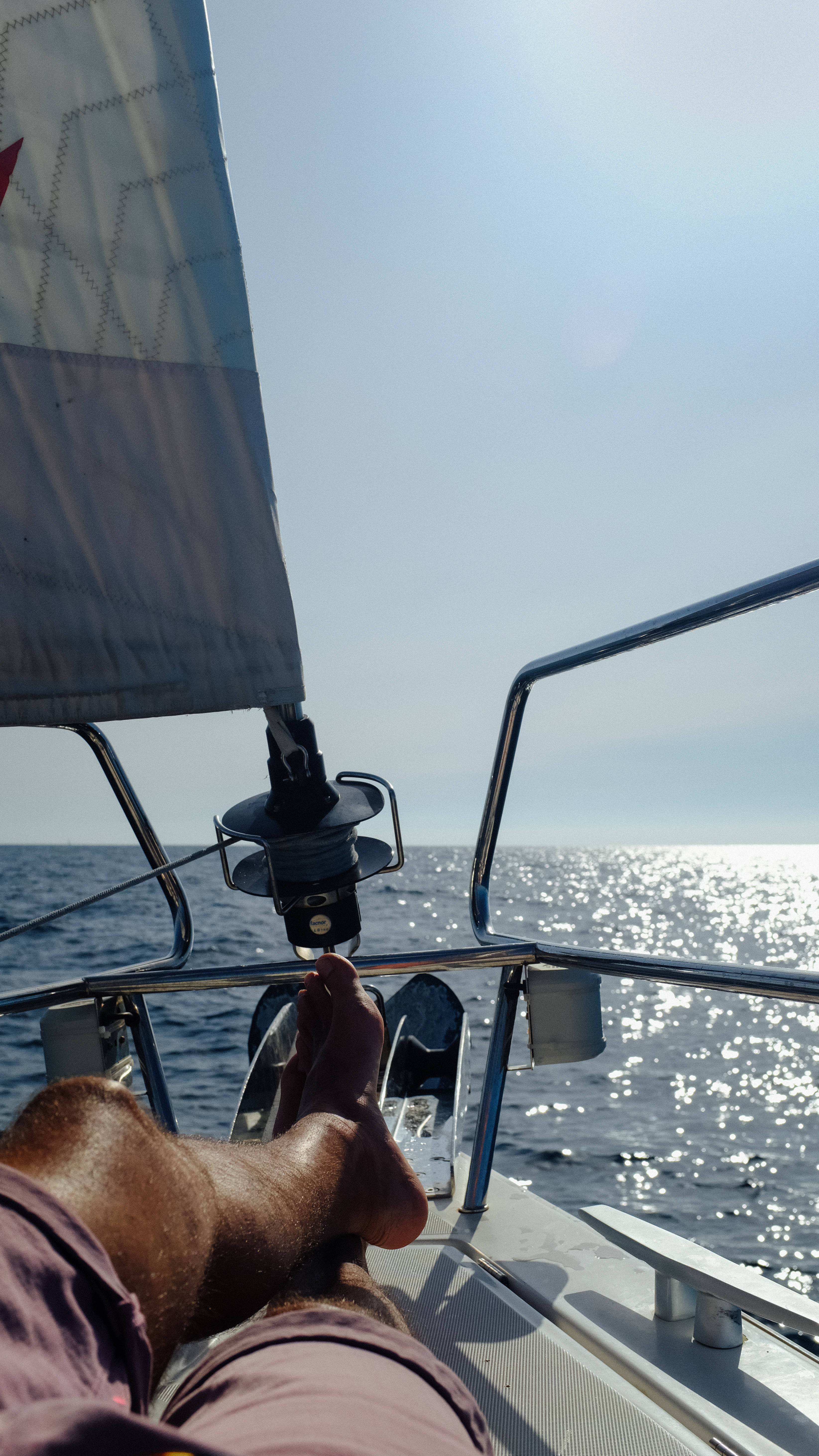 sailboat deck, sparkling blue ocean, bright sun, 5K Phone Wallpaper