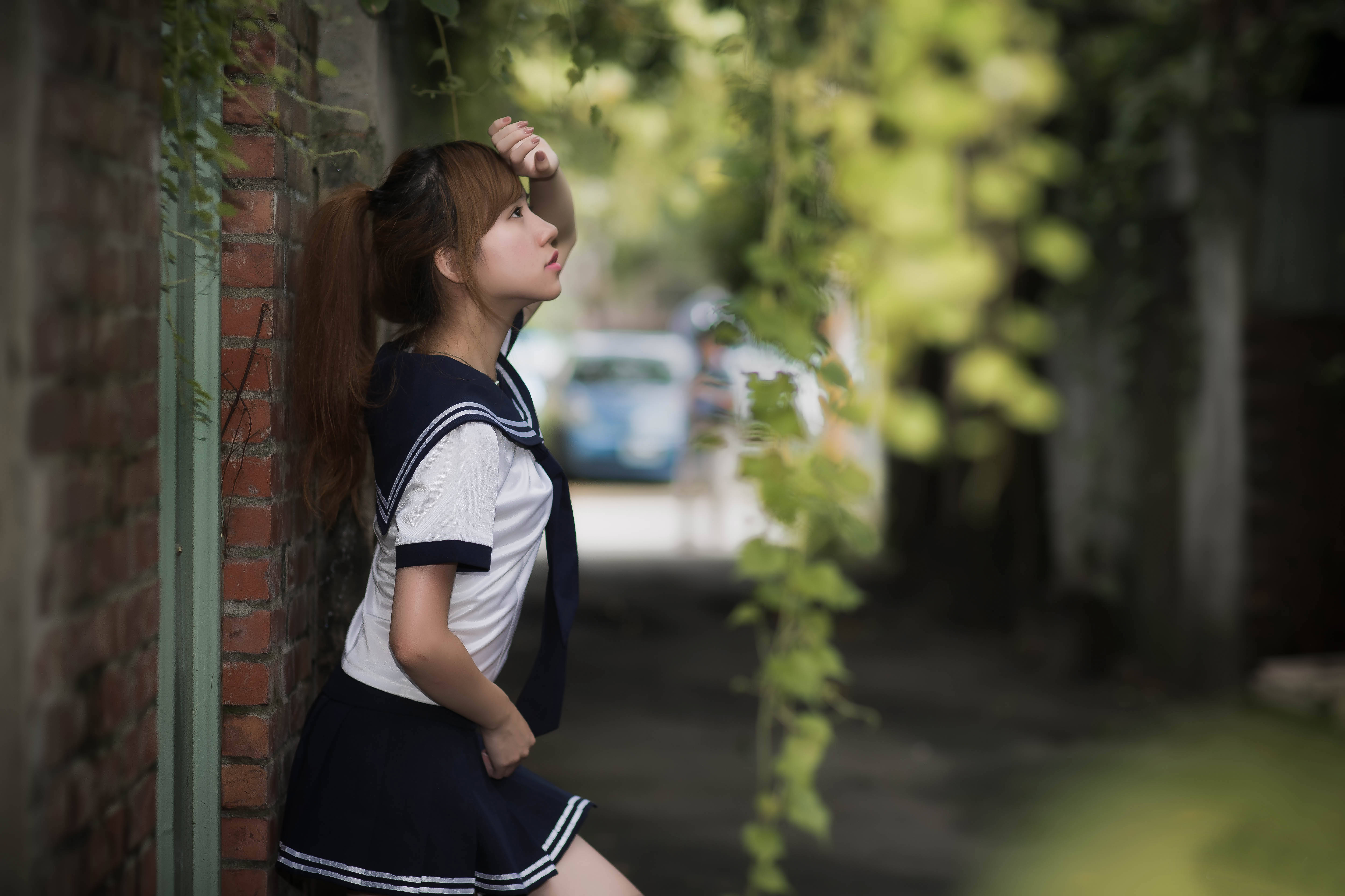sailor uniform, brick wall, dappled green foliage, 5K Desktop Wallpaper