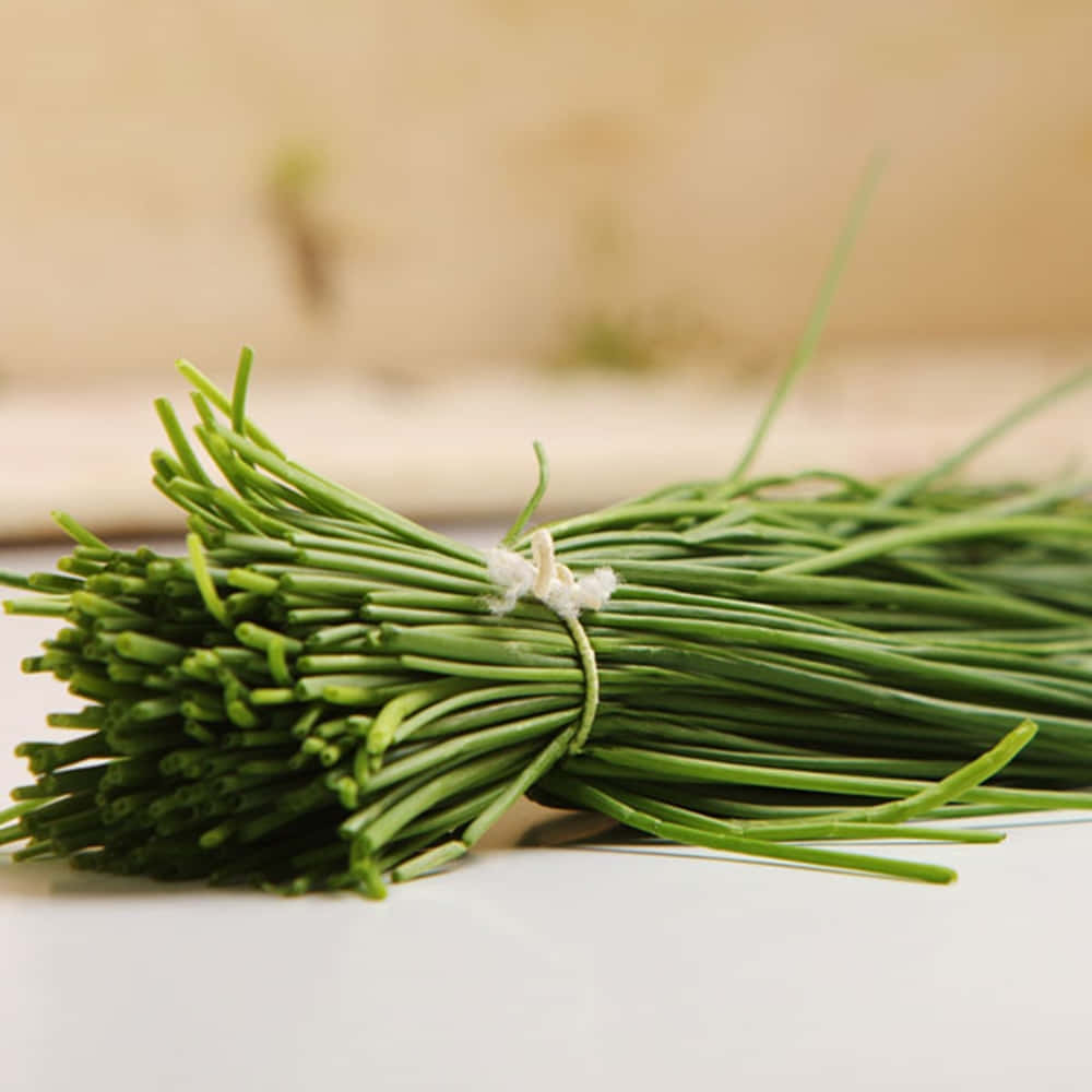 fresh green chives, white thread, clean white surface, SD Desktop Wallpaper