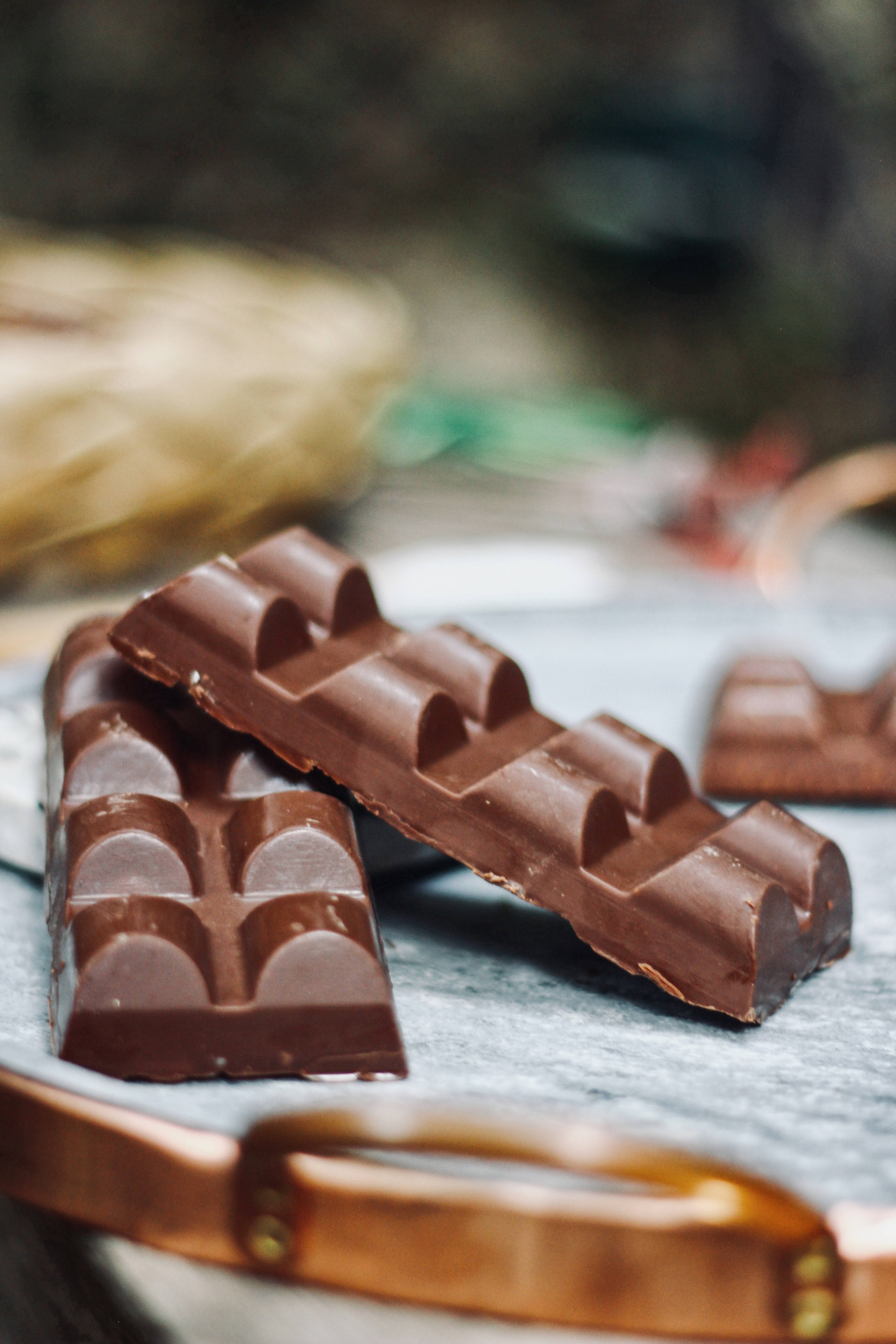 dark chocolate bars, textured segments, marble surface, 5K Phone Wallpaper