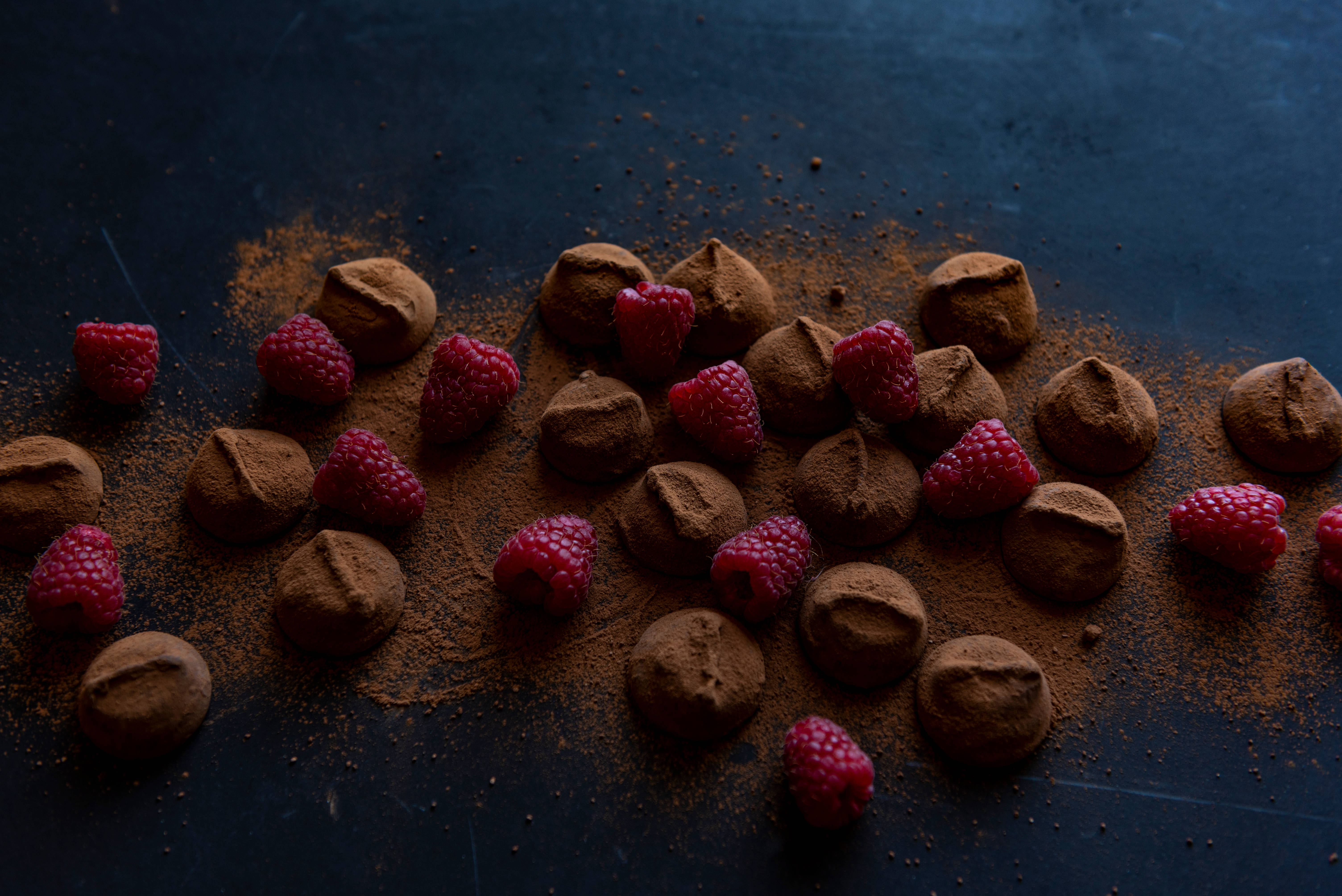 chocolate truffles, cocoa powder, vibrant red raspberries, 5K Desktop Wallpaper