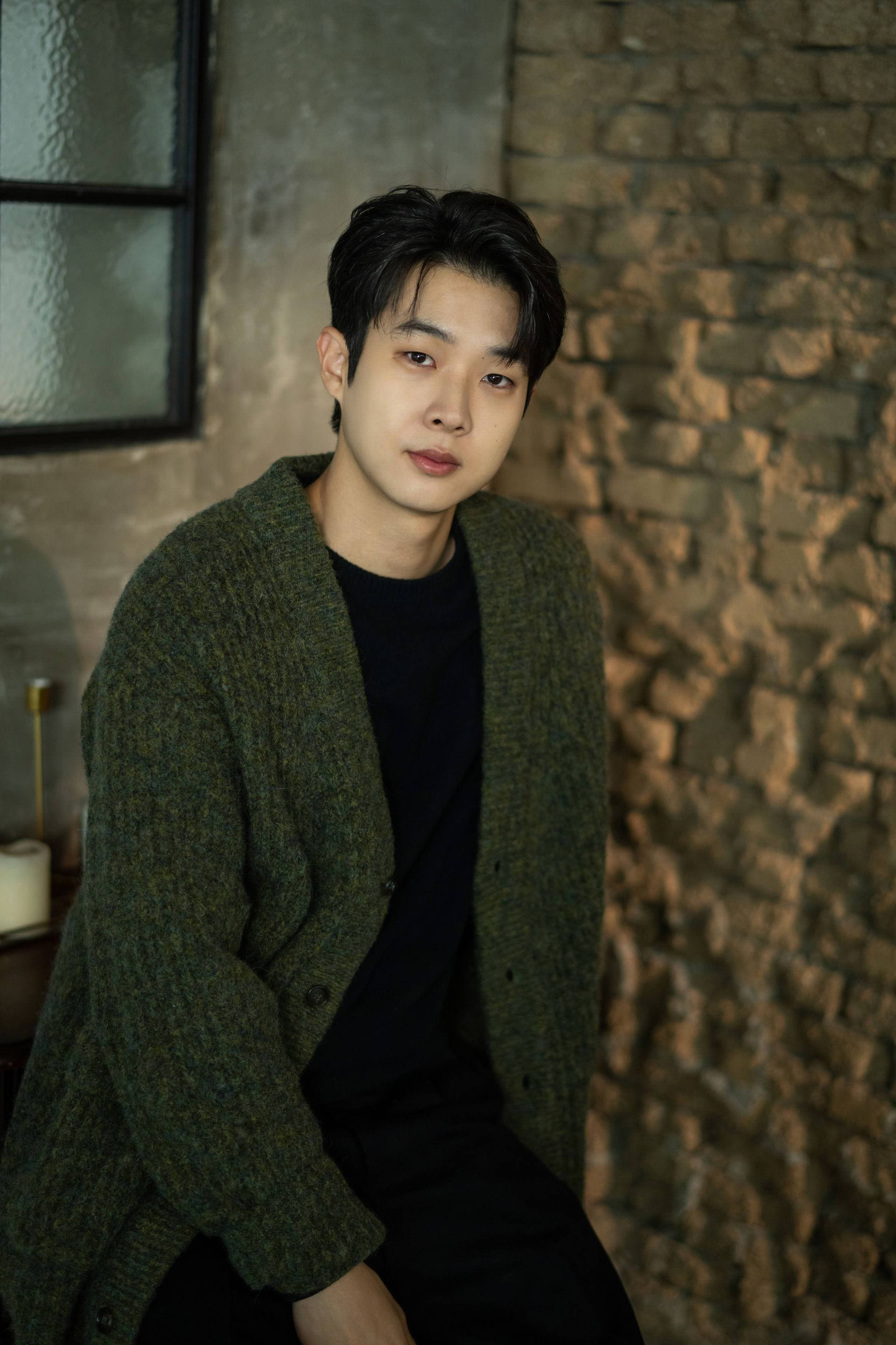 Choi Woo Shik, green knit cardigan, textured brick wall, 2K Phone Wallpaper