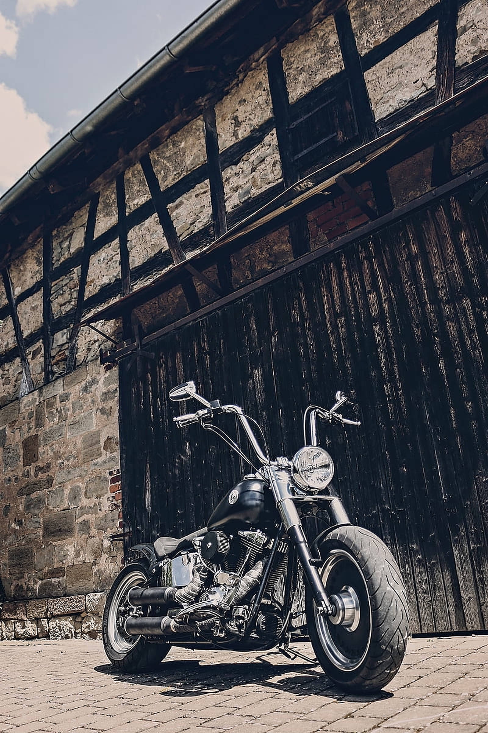 chopper motorcycle, gleaming black, cobblestones, Full HD Phone Wallpaper