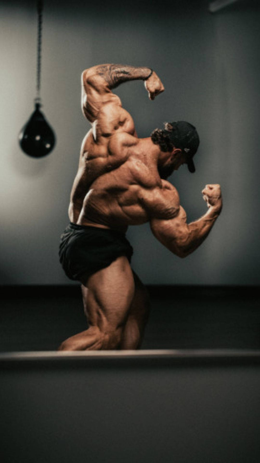 Chris Bumstead, speed bag, dimly lit gym, Full HD Phone Wallpaper