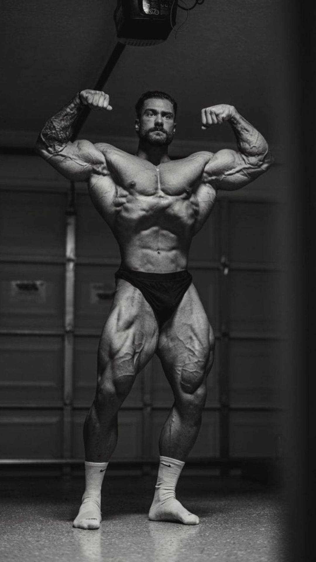 Chris Bumstead, double front bicep pose, black and white photo, Full HD Phone Wallpaper