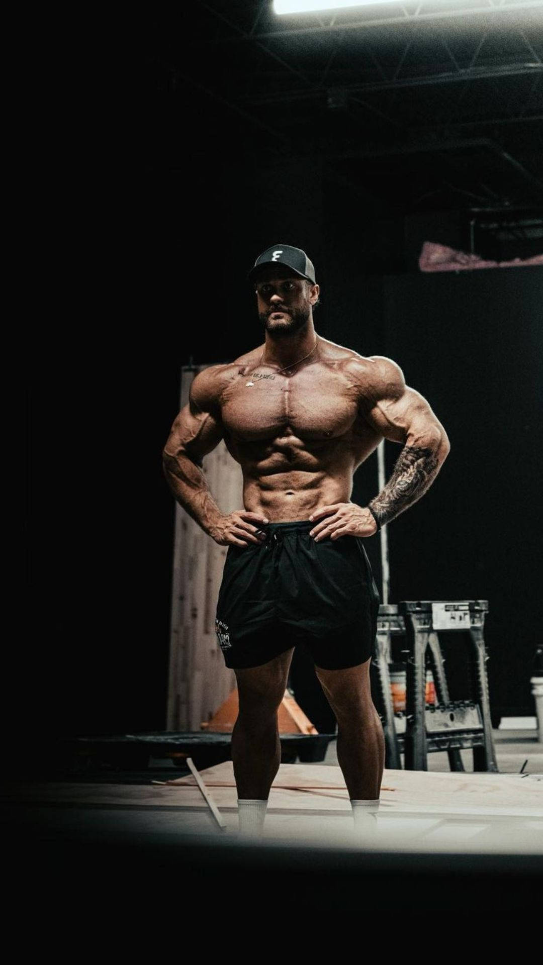 Chris Bumstead, black shorts, black cap, Full HD Phone Wallpaper