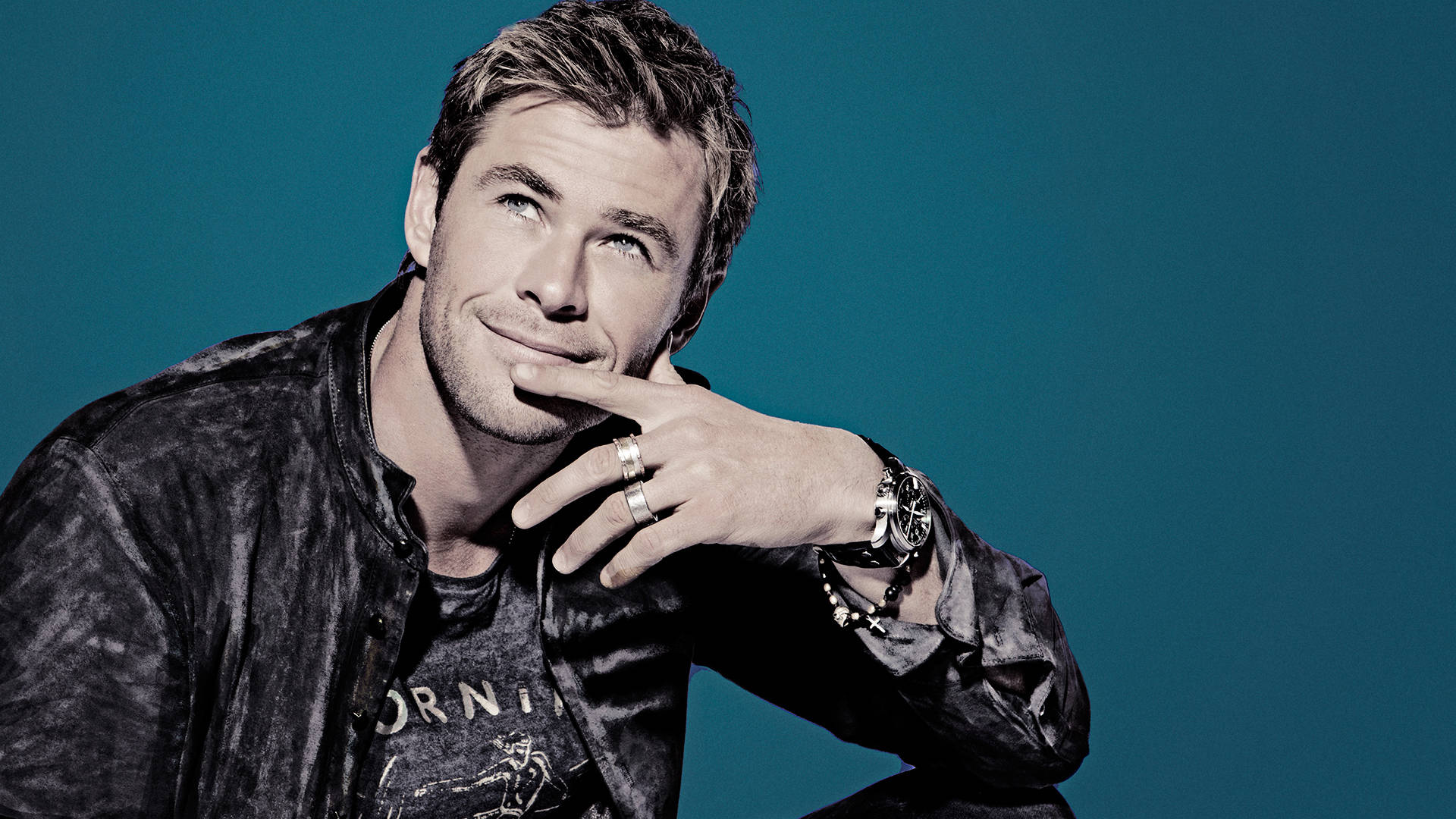 Chris Hemsworth, black leather jacket, teal backdrop, Full HD Desktop Wallpaper