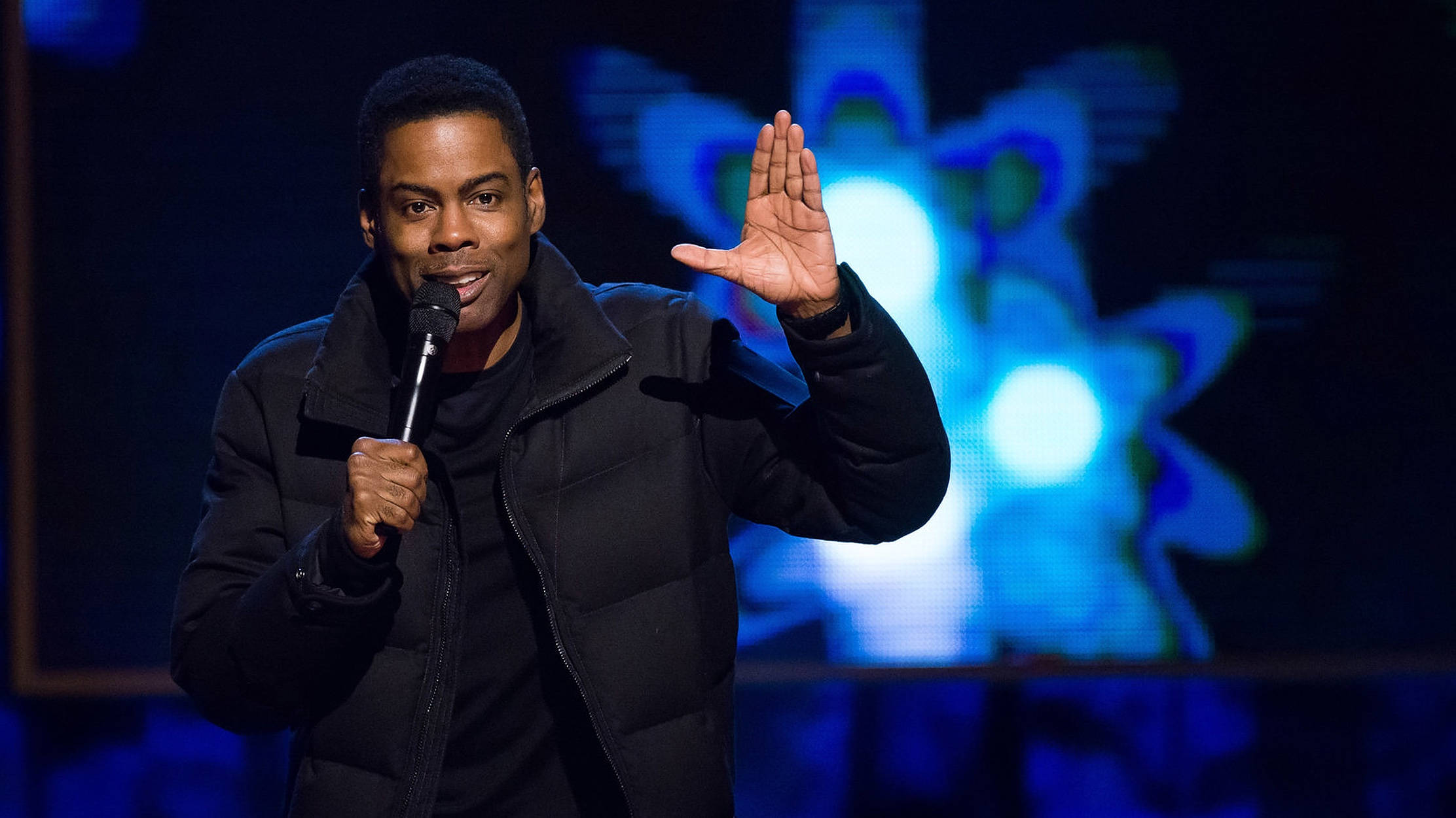 Chris Rock, live stand-up performance, glowing blue abstract backdrop, Full HD Desktop Wallpaper