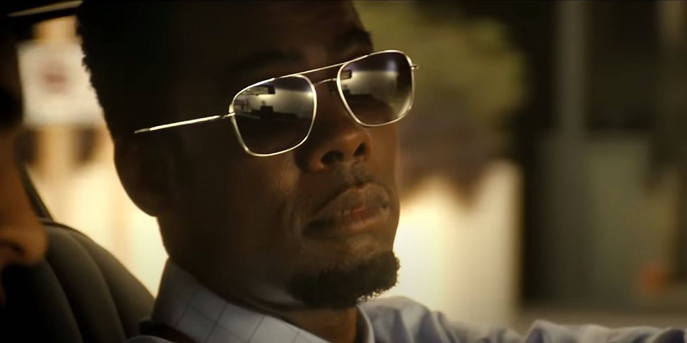 Chris Rock, aviator sunglasses, warmly lit car interior, Full HD Desktop Wallpaper
