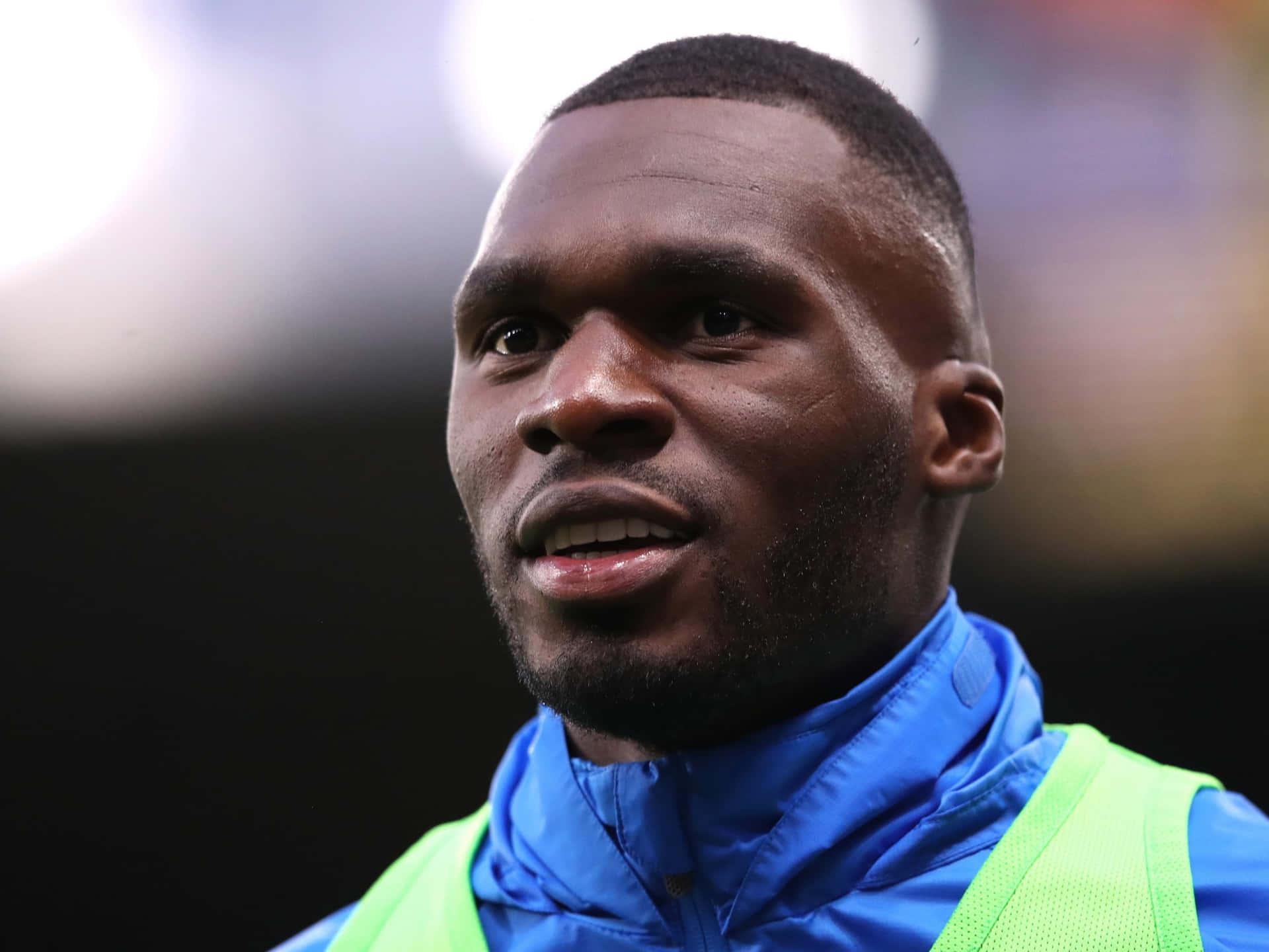 Christian Benteke, blue raincoat, neon green vest, Full HD Desktop Wallpaper