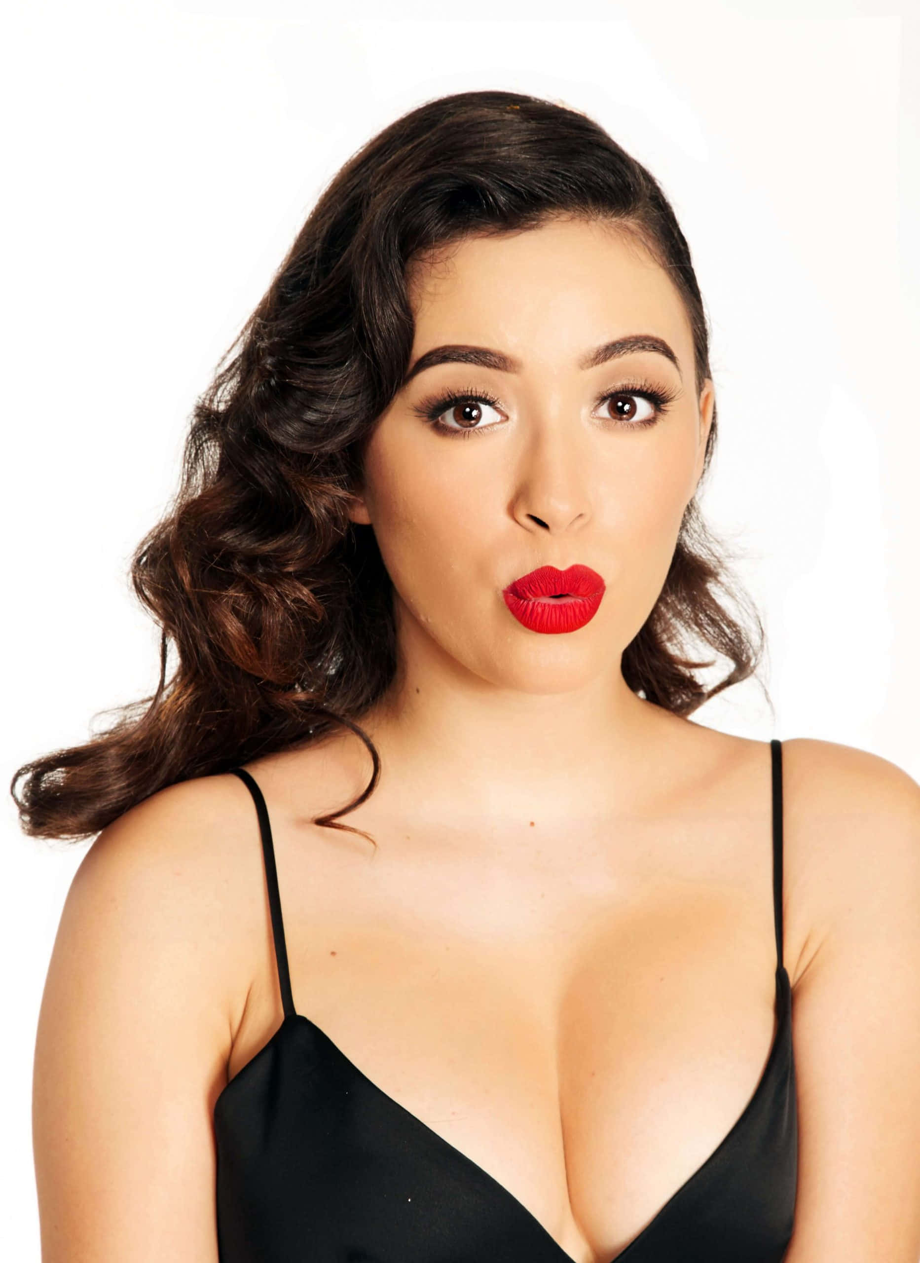 Christian Serratos, dark wavy hair, bold red lips, 2K Phone Wallpaper
