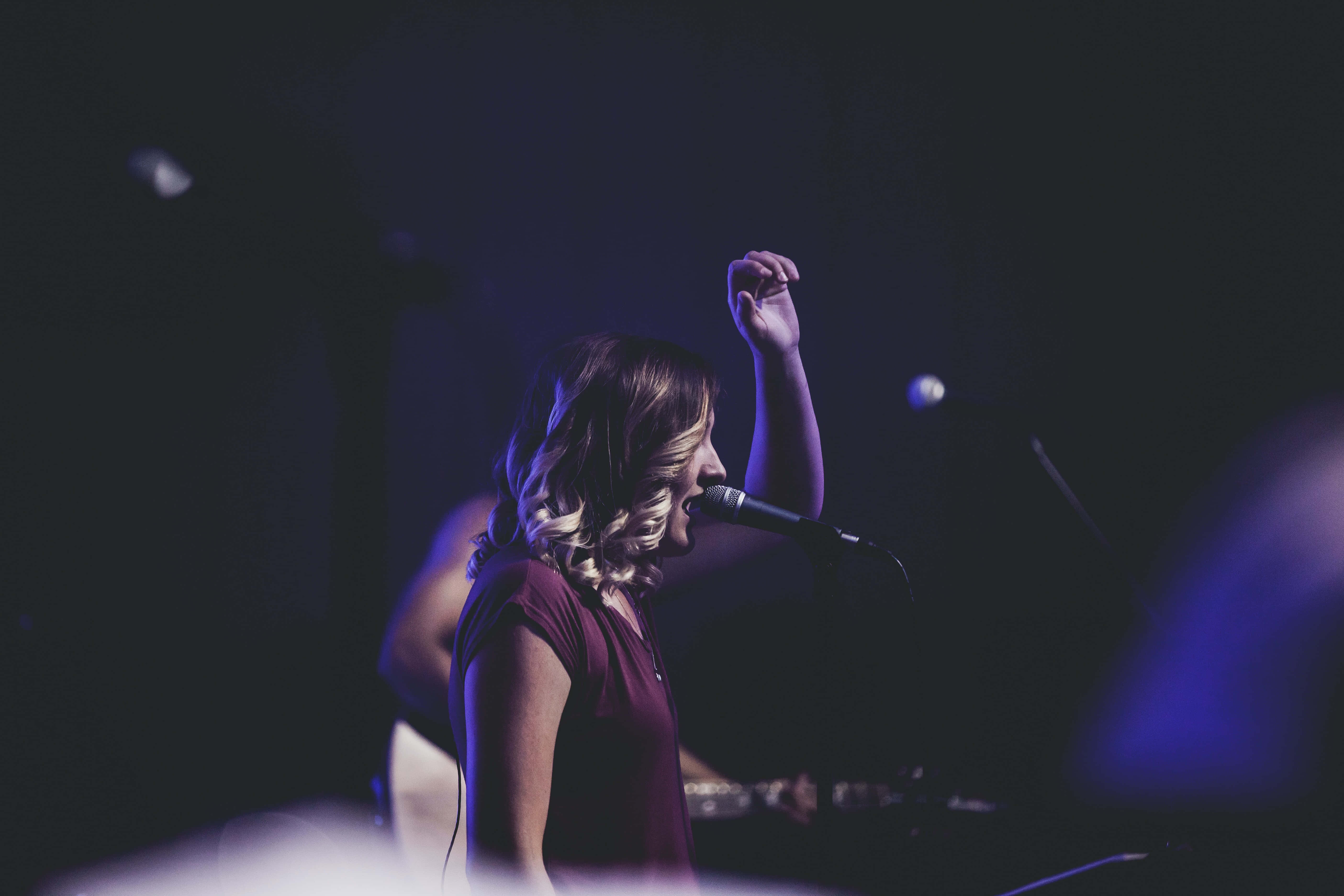 female singer, stage, moody purple lights, 5K Desktop Wallpaper