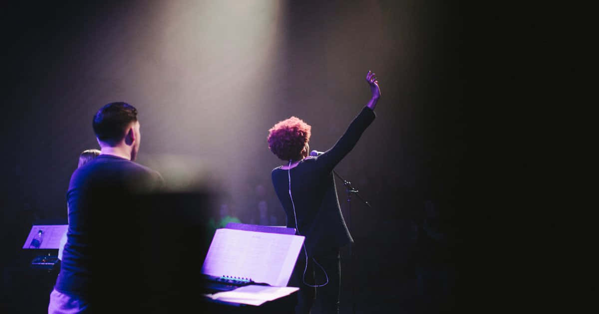 red hair, dimly lit stage, purple spotlights, SD Desktop Wallpaper
