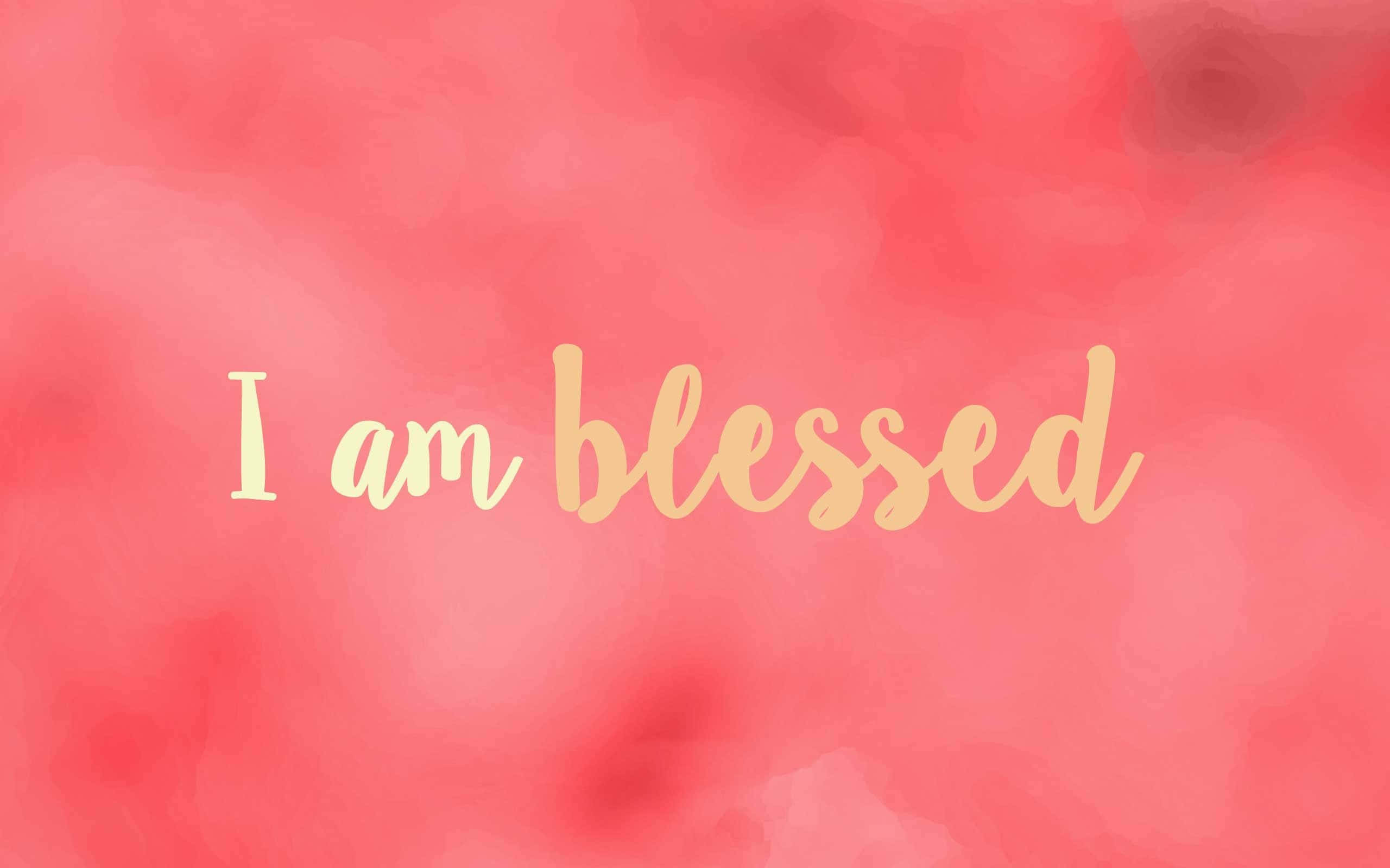 Christian Desktop Blessed, soft coral watercolor background, golden cursive text, 2K Desktop Wallpaper