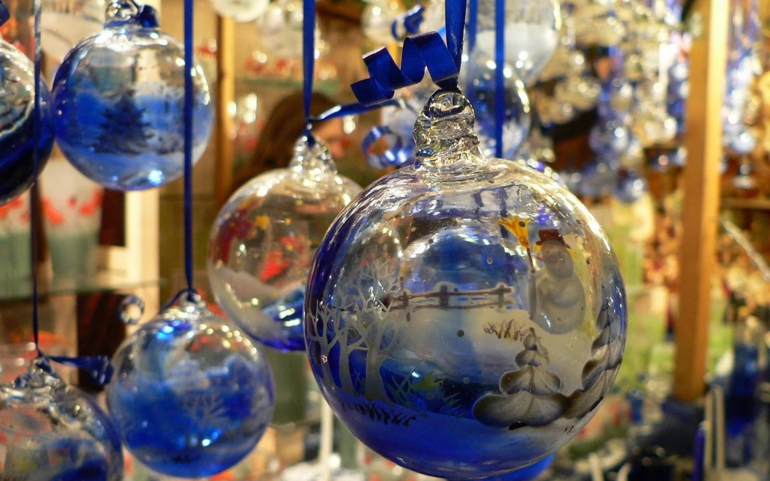 transparent blue glass Christmas balls, hand-blown glass ornaments, painted winter scenes, 2K Desktop Wallpaper