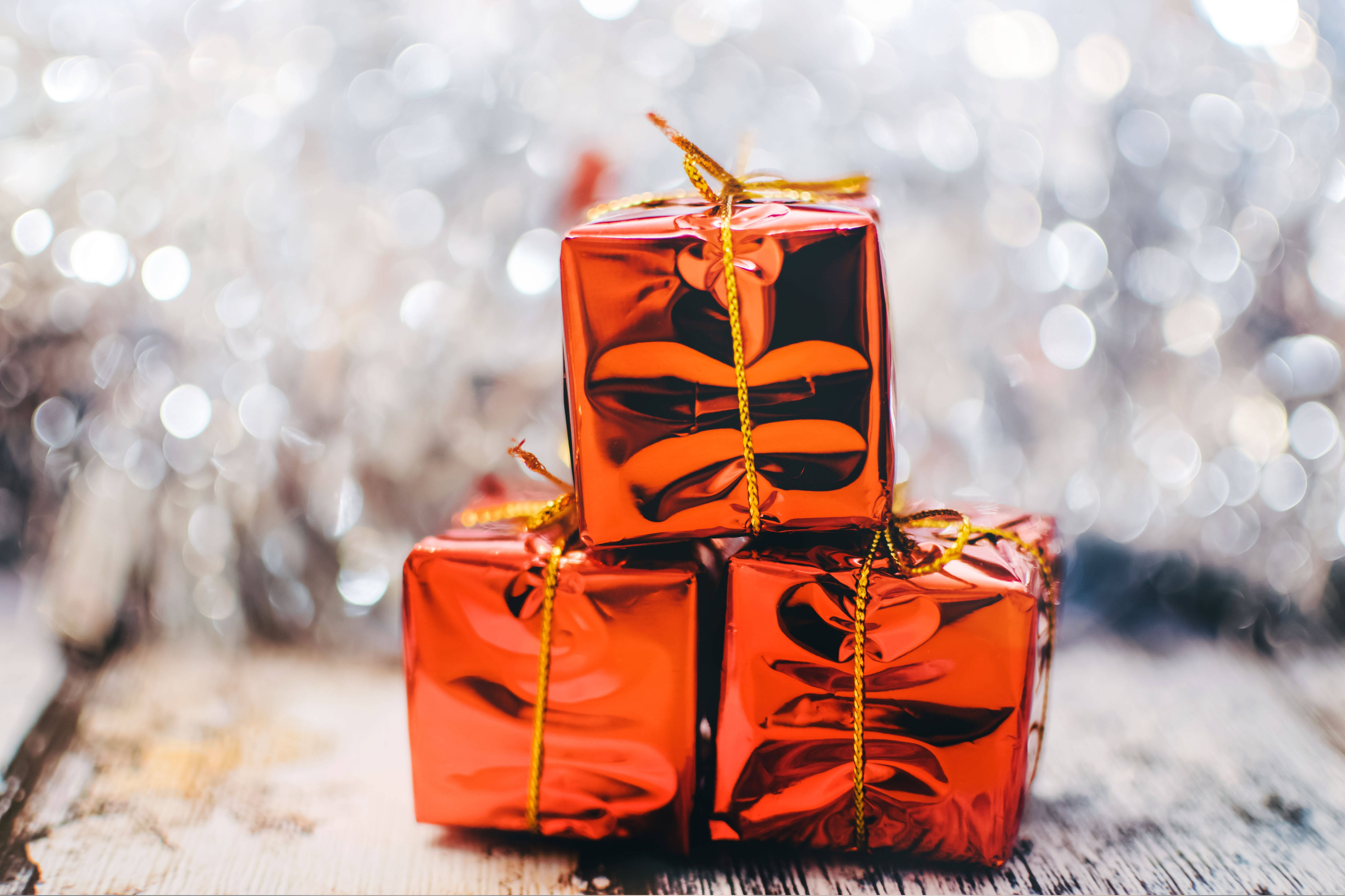 red gift boxes, gold ribbon, rustic wooden surface, 5K Desktop Wallpaper