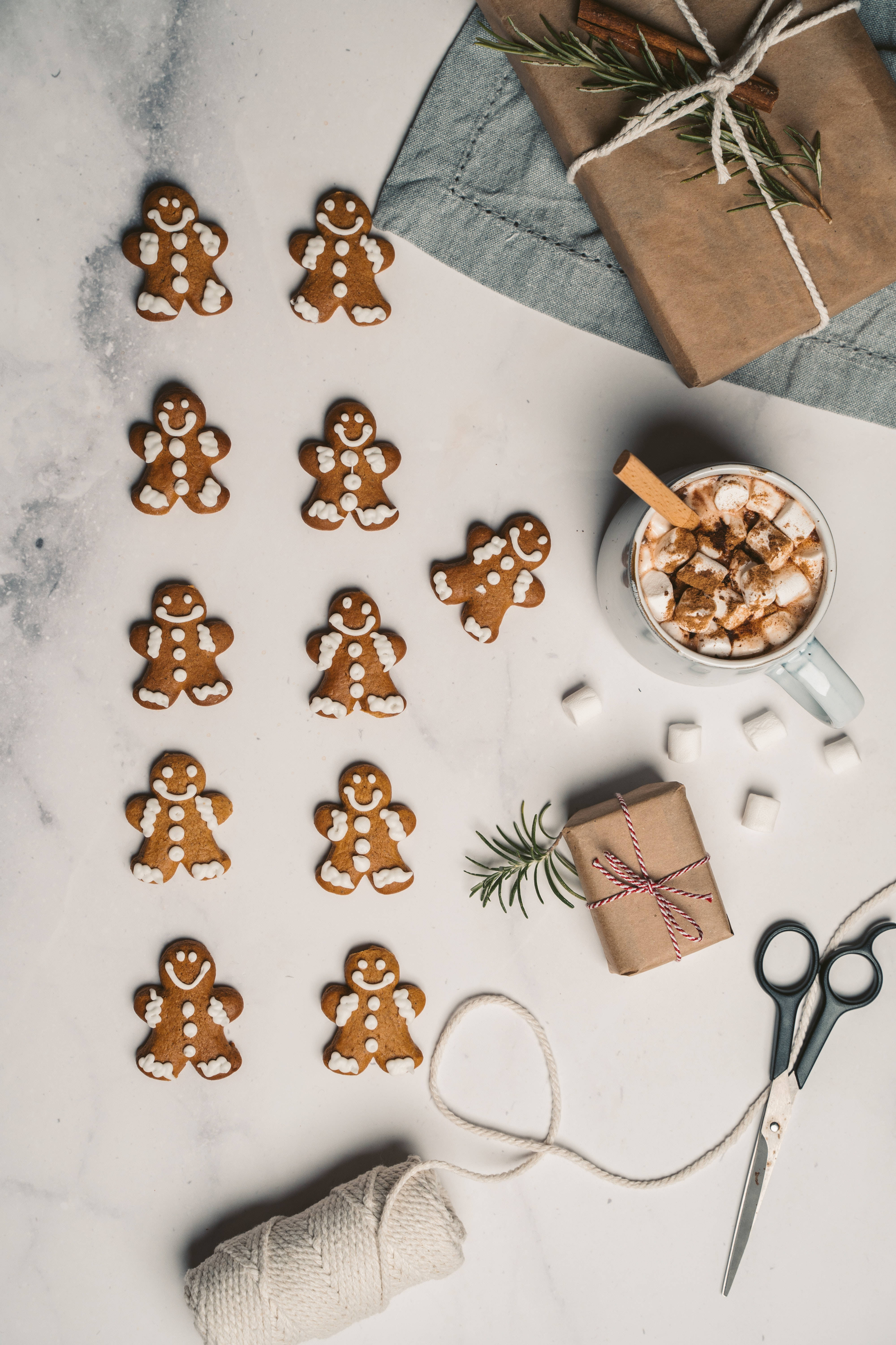 Gingerbread men cookies, marble surface, mug of hot cocoa, 5K Phone Wallpaper