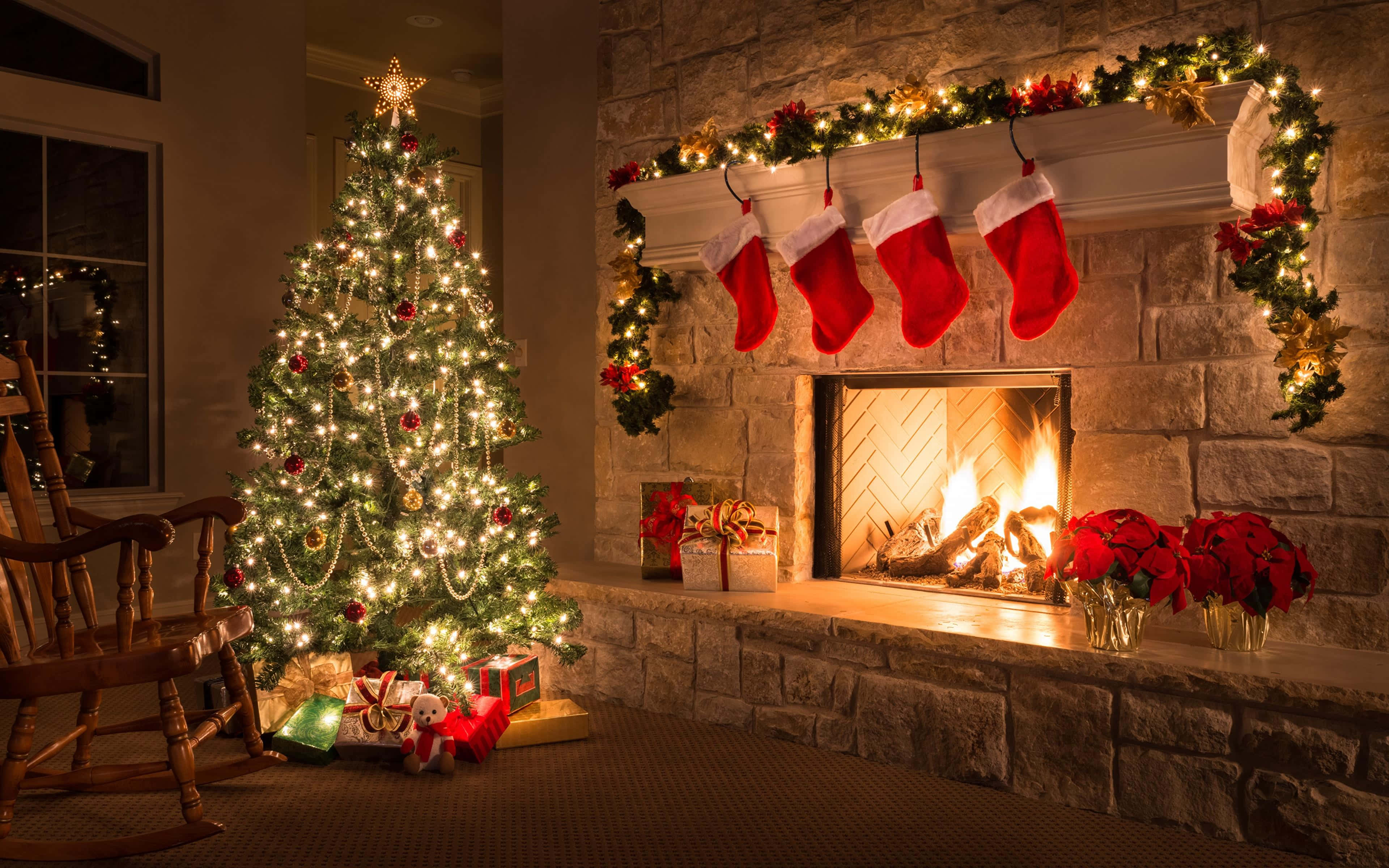 cozy christmas fireplaceand tree, glowing stone fireplace, stockings, 4K Desktop Wallpaper