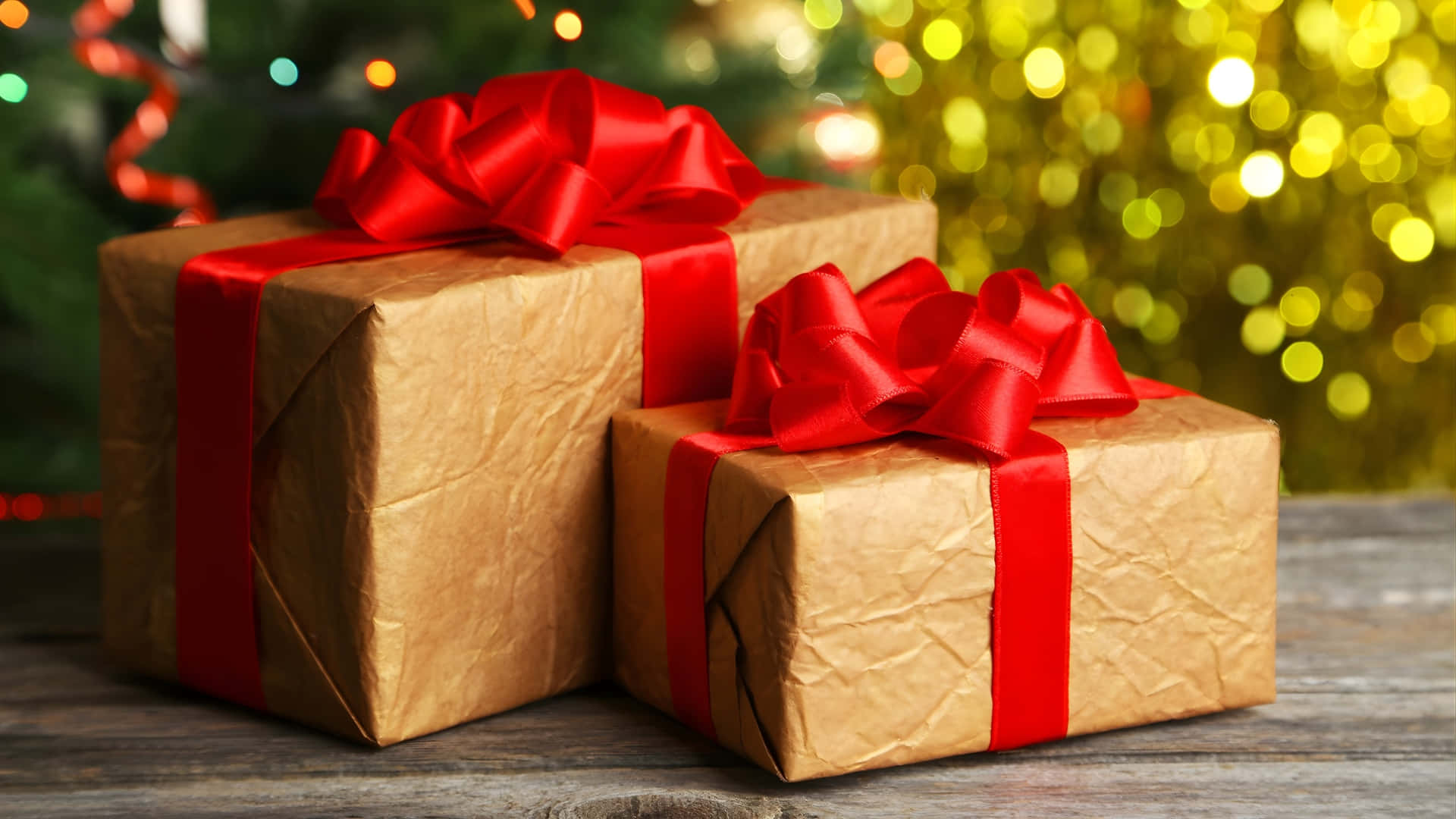 brown paper wrapped gifts, red bows, wooden surface, Full HD Desktop Wallpaper