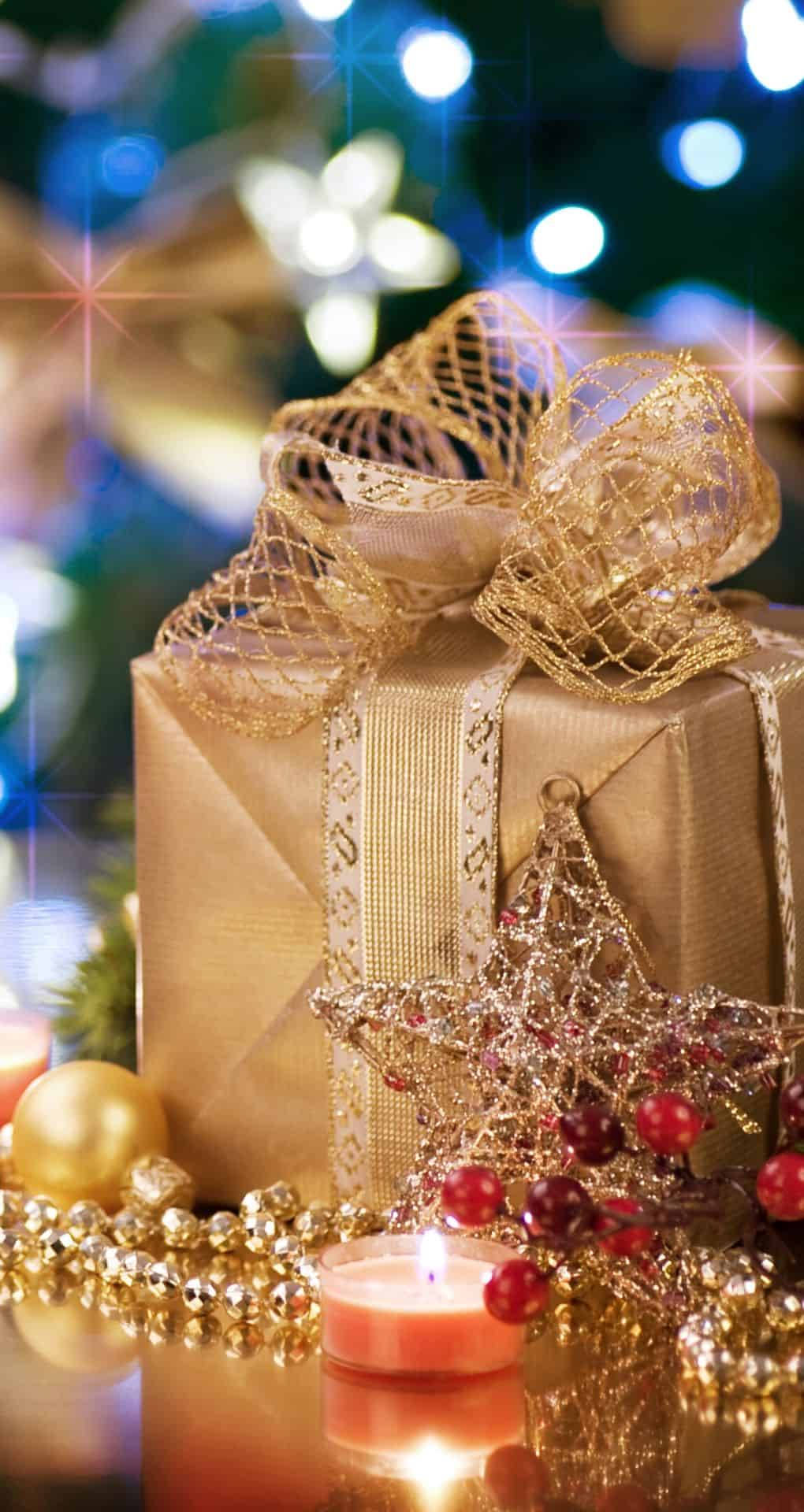 gold gift box, shimmering bow, lit candle, Full HD Phone Wallpaper